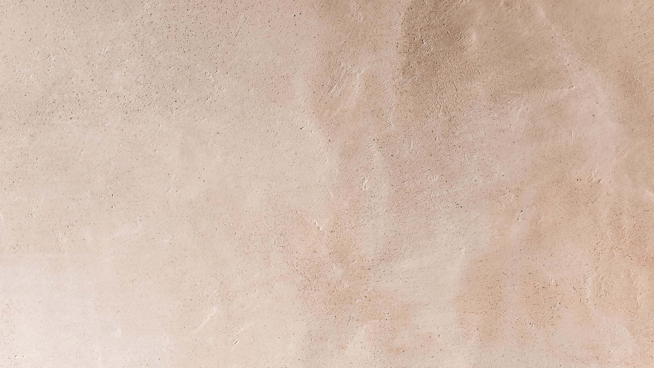 Wall Texture 桌布 壁紙 — 淺米色光滑灰泥牆的近距離特寫，帶有微妙的紋理變化和柔和漸變色調。