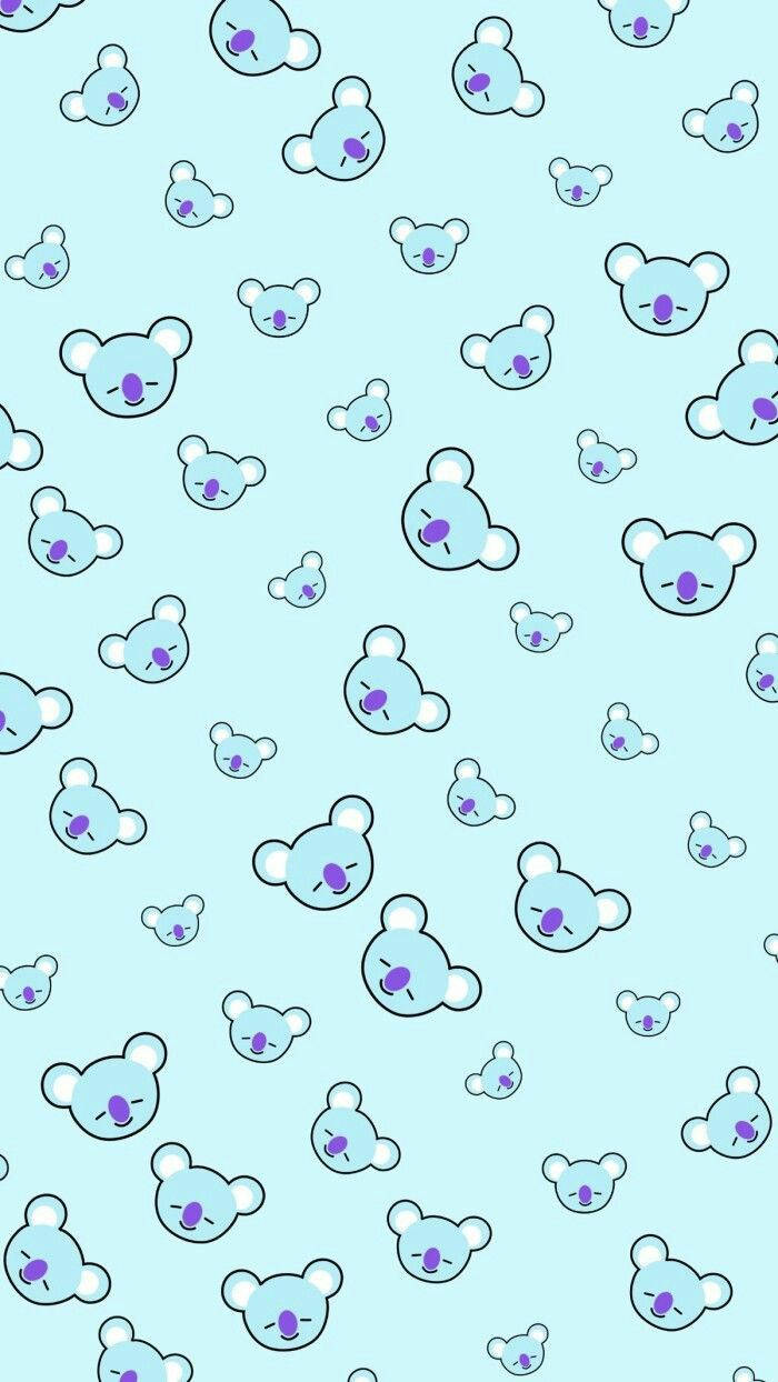 BT21 桌布 壁紙 — 淺藍色壁紙，充滿可愛卡通無尾熊臉孔，大小和表情各異。