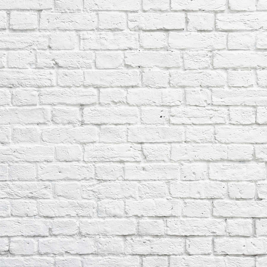 White Brick Wall 桌布 壁紙 — 清潔白色油漆磚牆的特寫，顯示出有紋理的砂漿和細微的瑕疵。
