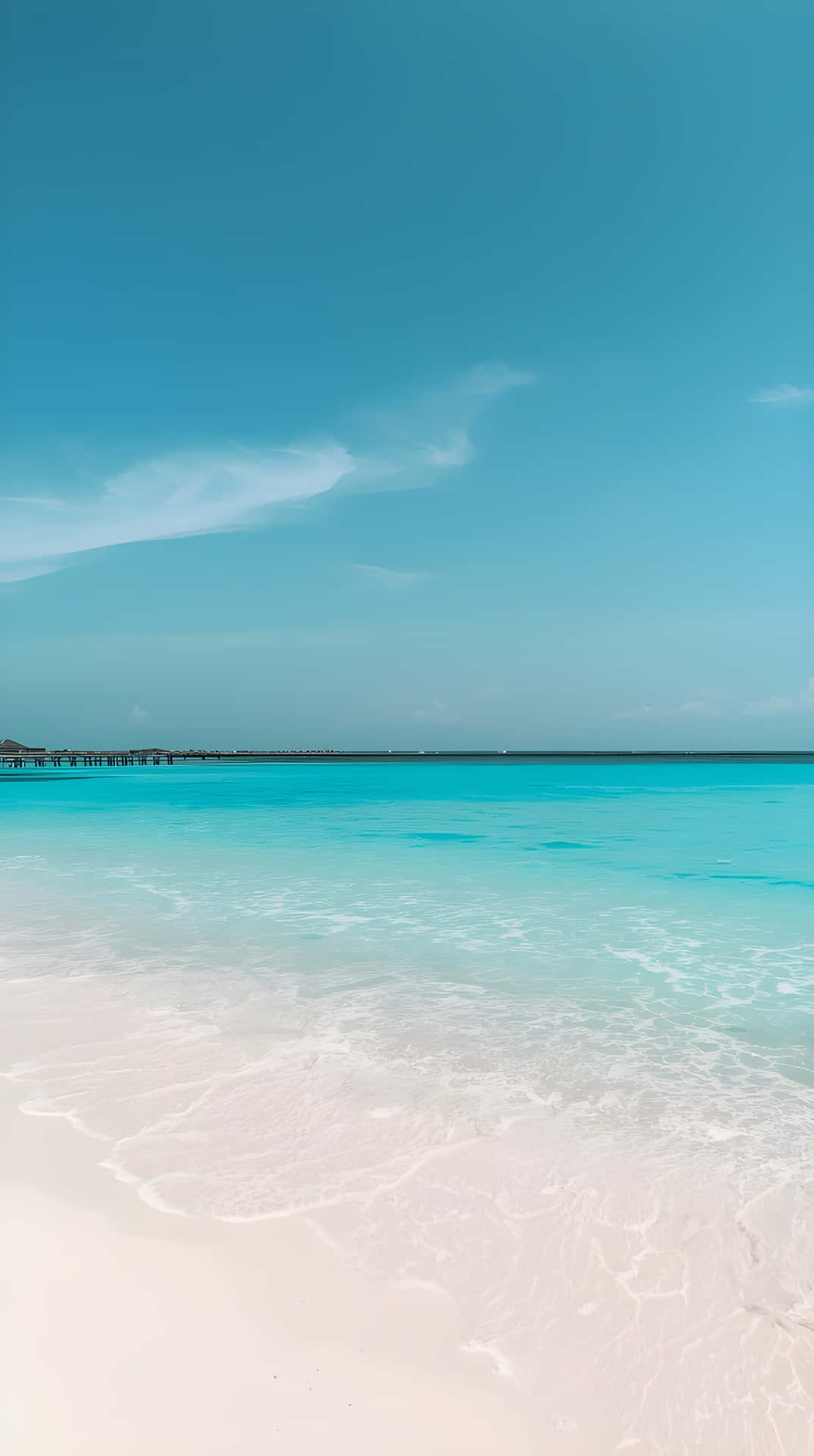 Pristine White Sand Beach with Sunny Blue Sky Wallpaper 壁紙 — 清澈的碧綠海水輕輕拍打著純淨的白色沙灘，上方是廣闊寧靜的藍天。