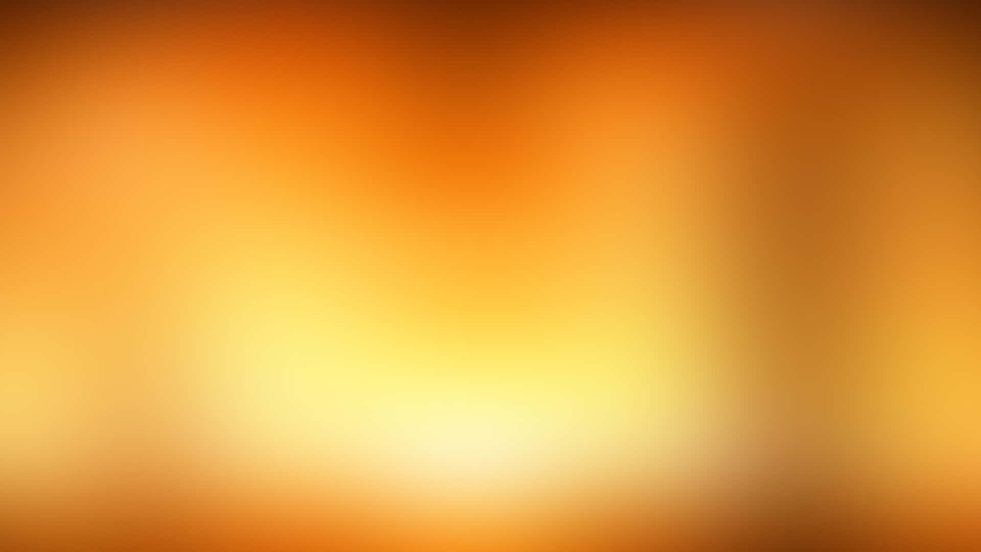 橘色美學 桌布 壁紙 — 溫暖橙色和黃色的柔和漸變，融合成一個發光的中心。