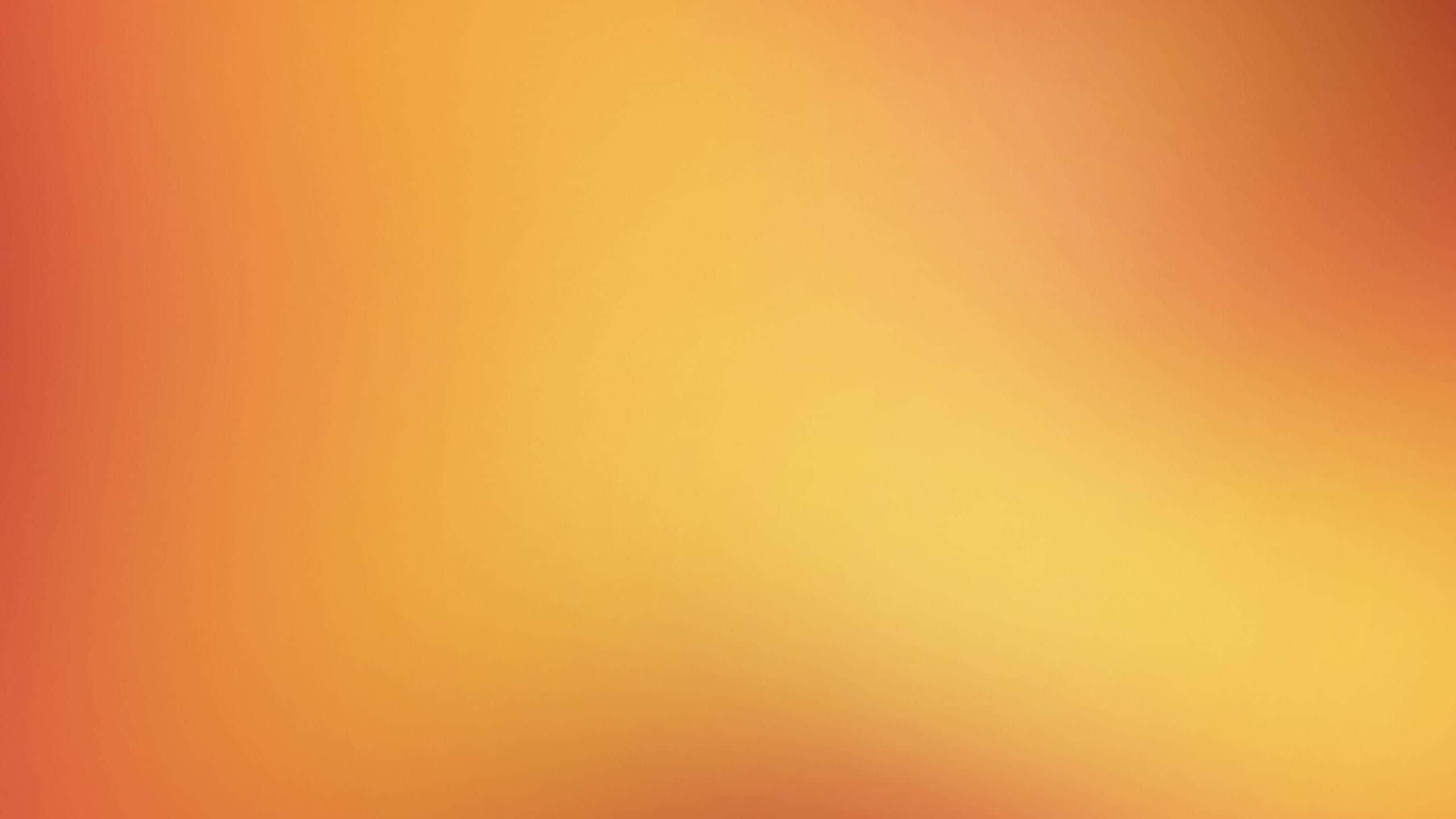 Light Orange 桌布 壁紙 — 溫暖橙色和黃色色調的平滑漸變，柔和地融合在整個畫面中。