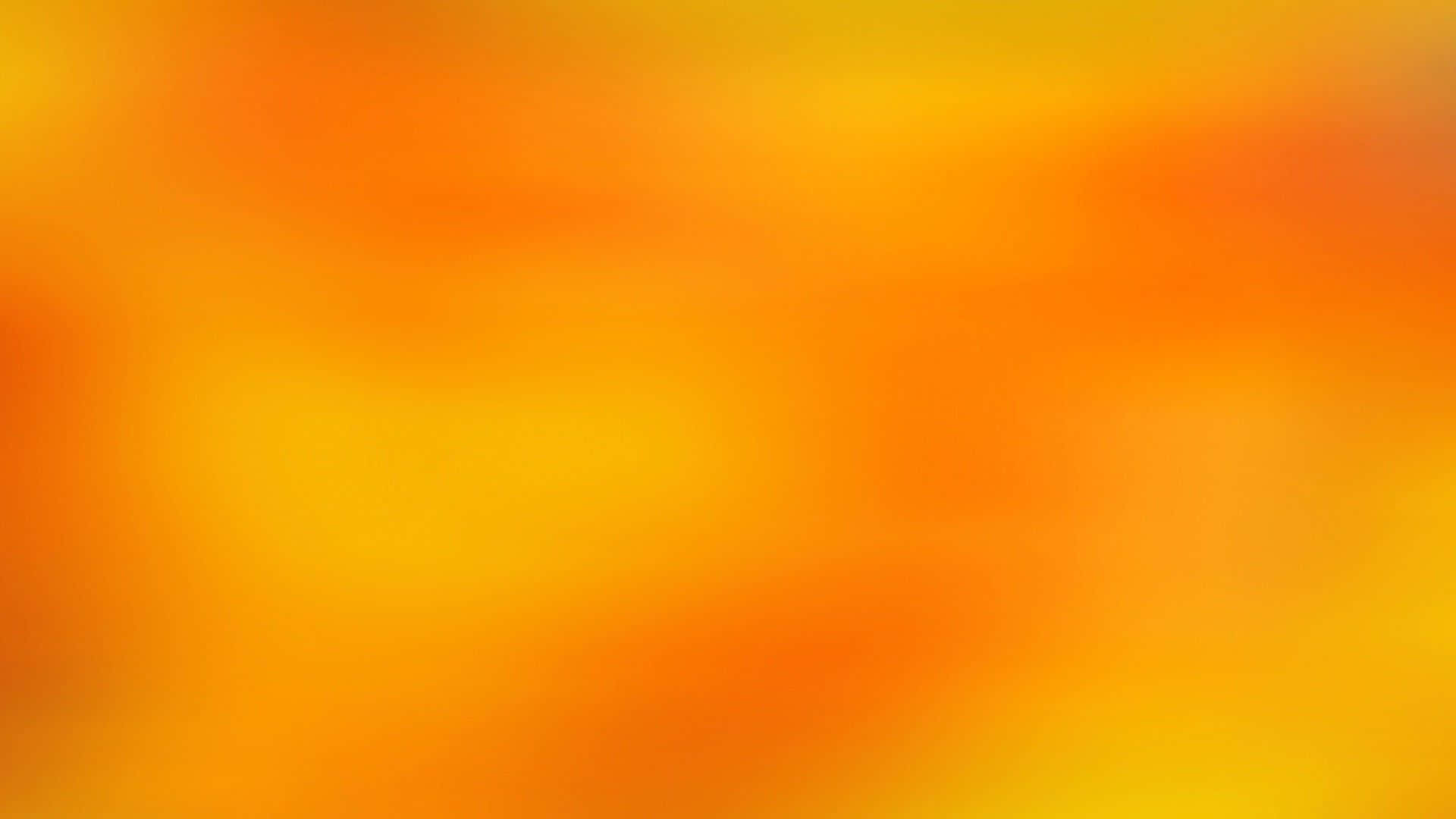 橘色 桌布 壁紙 — 溫暖橙色和黃色色調的柔和漸變，在畫面中無縫融合。