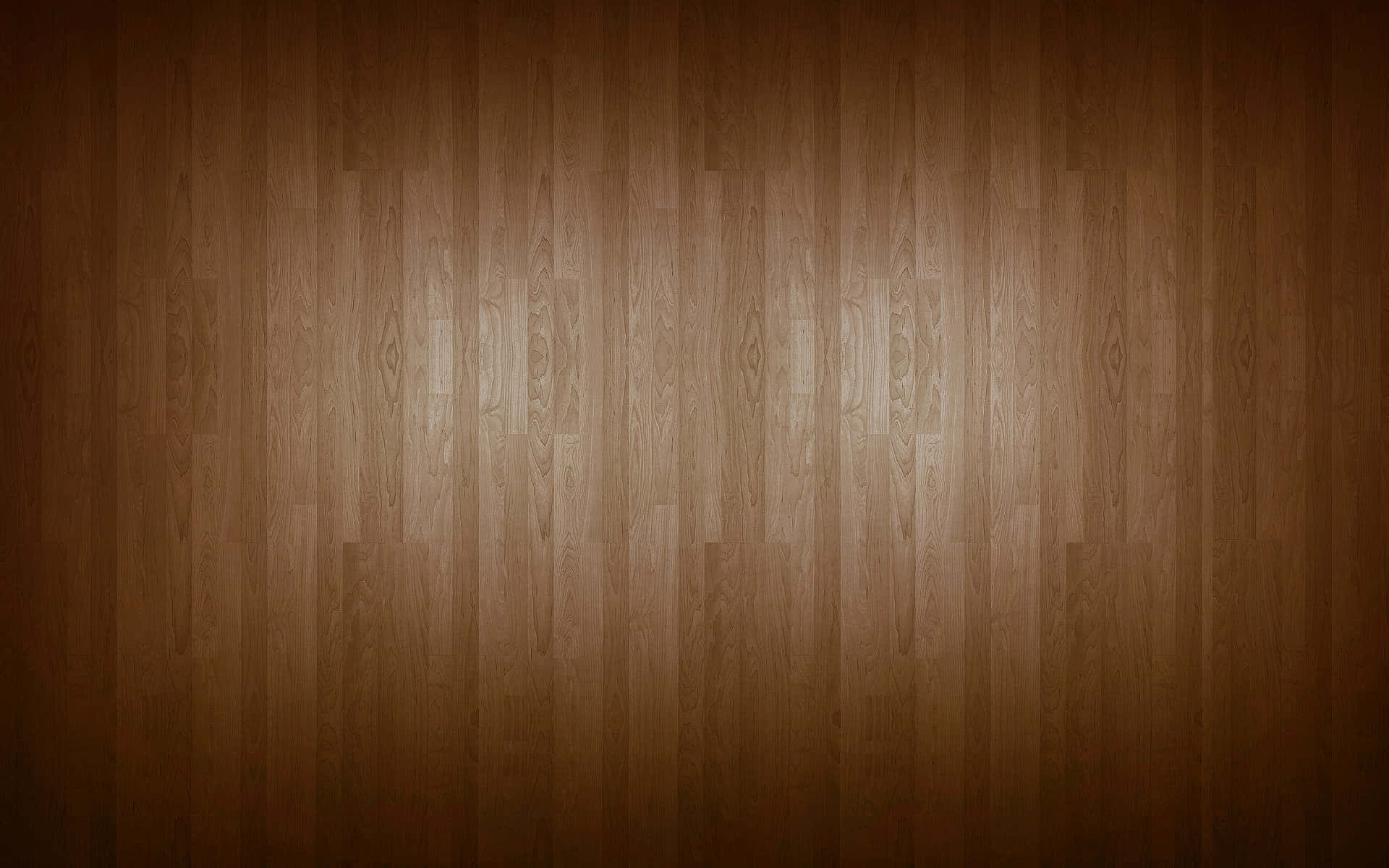 High Resolution Wood 桌布 壁紙 — 溫暖的木地板，帶有天然木紋圖案，從中央柔和照明，逐漸過渡到深色邊緣。