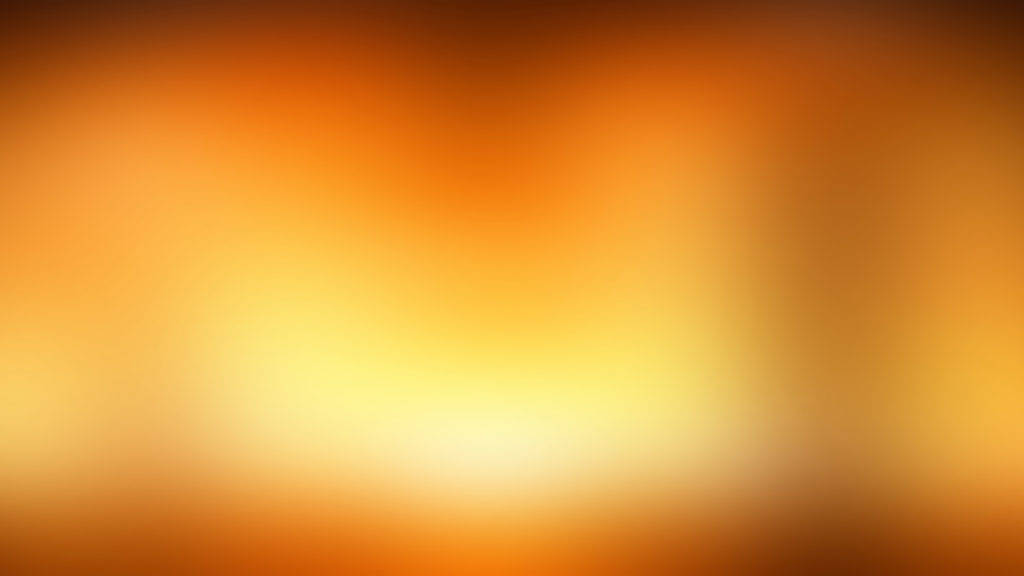 Orange And Yellow 桌布 壁紙 — 溫暖的橙色和黃色柔和漸變，融合成一個發光的中心。