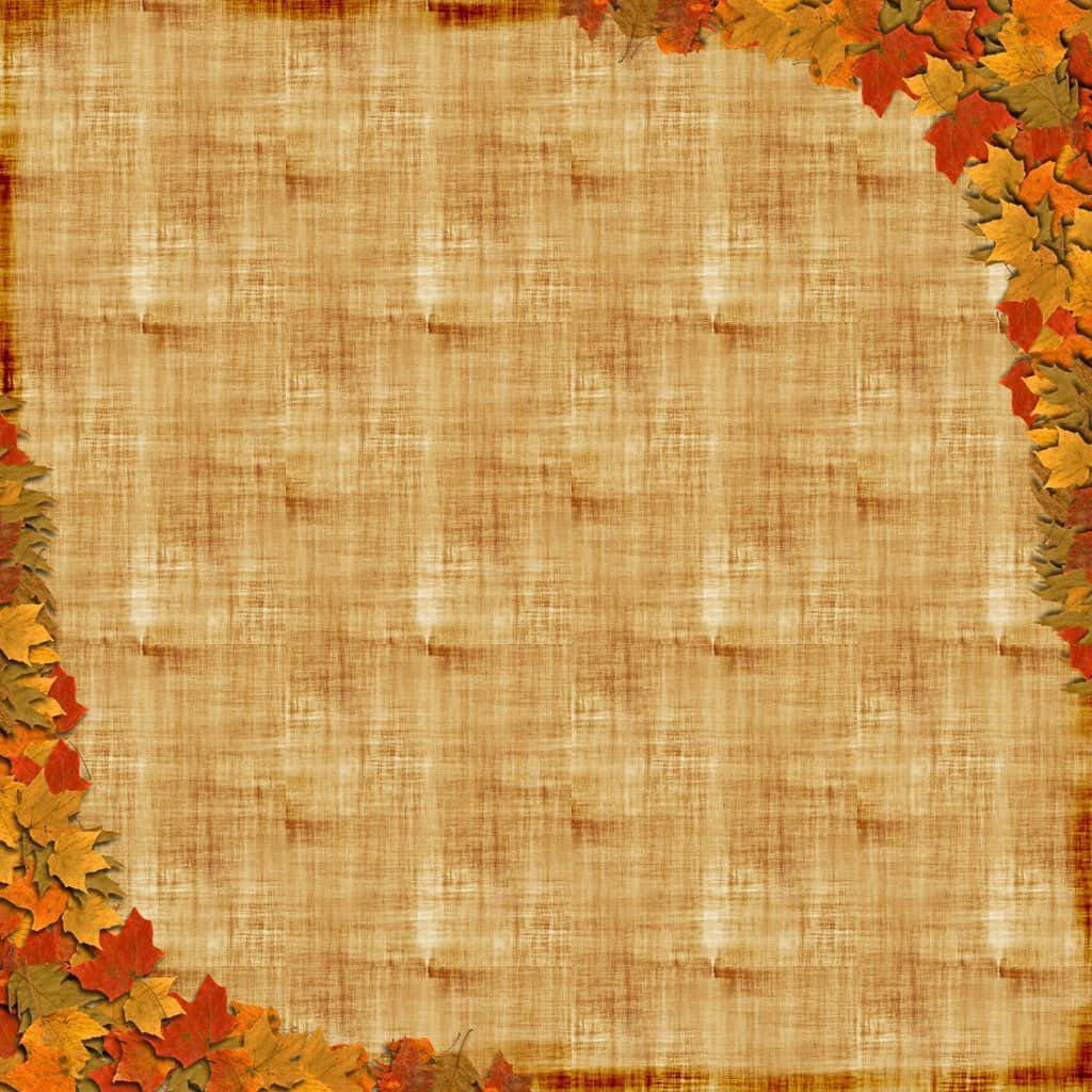Page 桌布 壁紙 — 溫暖的紅色、黃色和橙色秋葉框住有紋理的米色畫布，營造出舒適的季節性邊框。