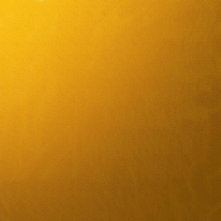 Gold Texture 桌布 壁紙 — 溫暖金黃色的平滑漸變，表面帶有細微紋理和柔和的光線變化。