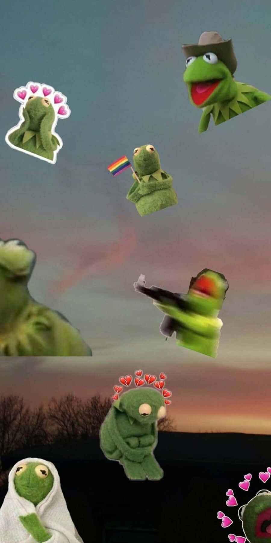 Aesthetic Frog 桌布 壁紙 — 漂浮的Kermit the Frog絨毛玩偶，帶有心形和彩虹旗，背景是暮色天空和光禿禿的樹木。
