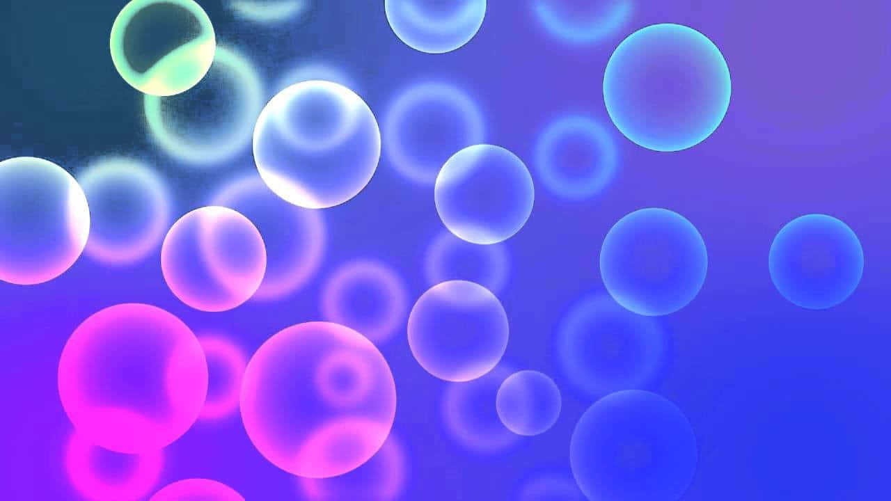 彩色動圖 桌布 壁紙 — 漂浮的半透明氣泡在漸變紫色背景上發出霓虹粉紅和藍色光芒。