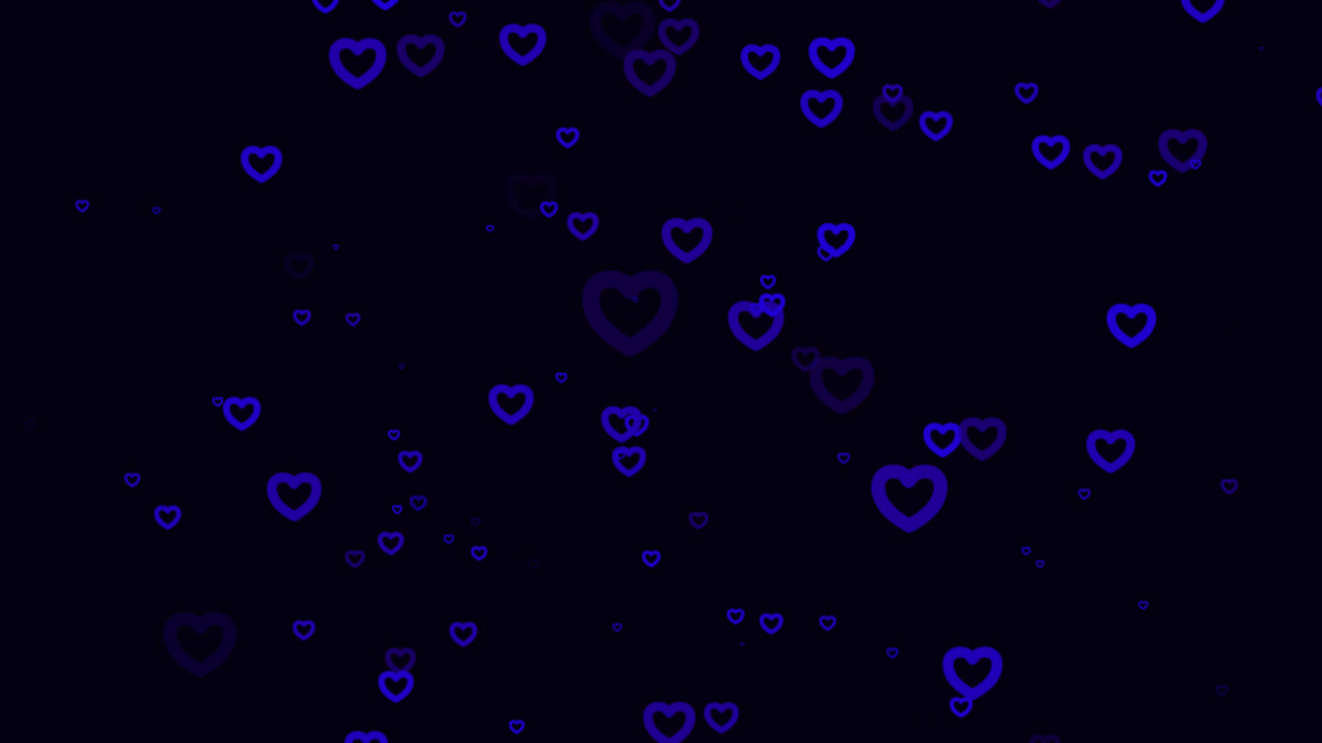 Blue Heart 桌布 壁紙 — 漂浮的發光藍色心形在深黑色背景上以柔和的數位動畫飄移。