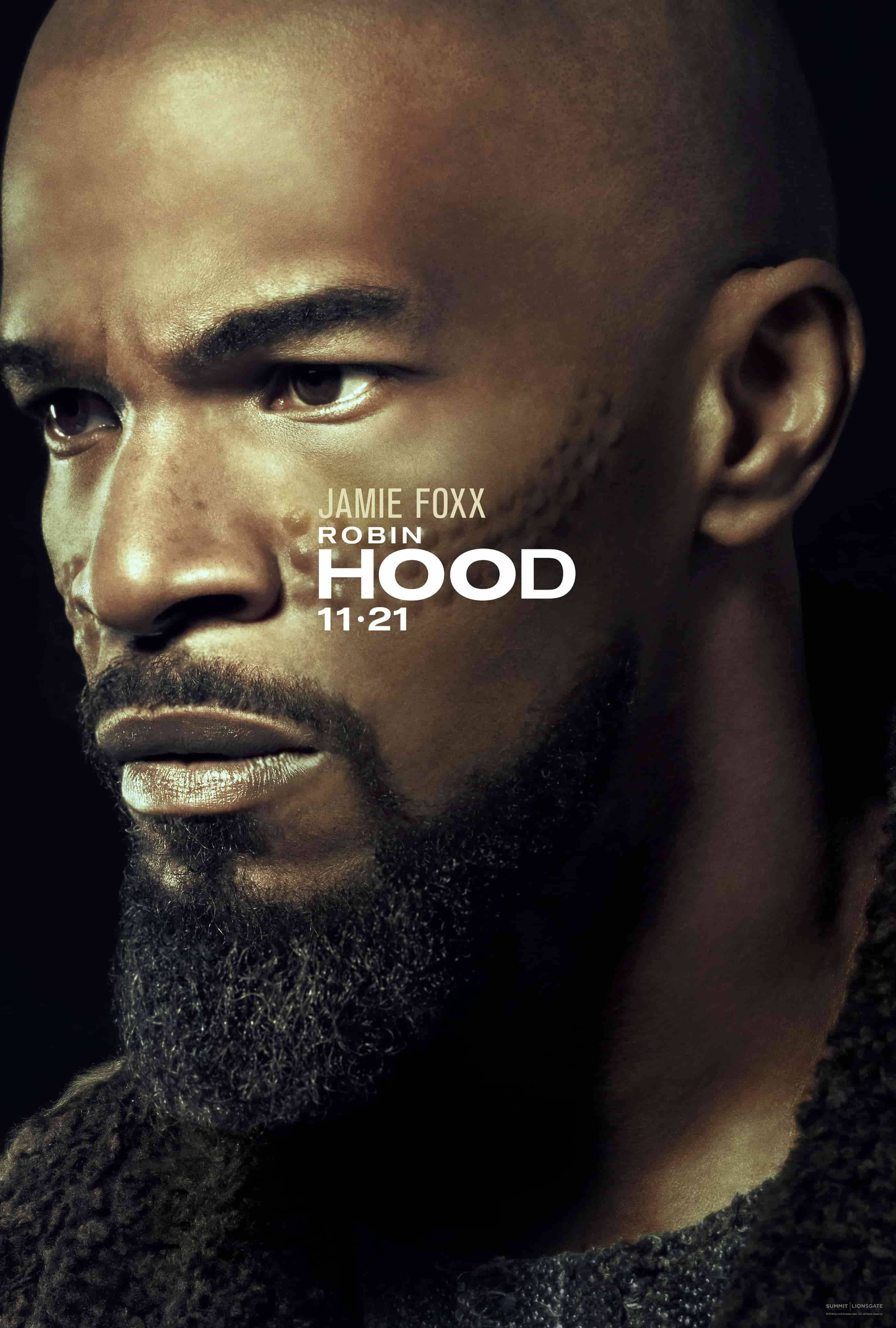 Jamie Foxx 桌布 壁紙 — 演員傑米·福克斯飾演羅賓漢的特寫肖像，眼神銳利，穿著質感針織毛衣，背景深色。