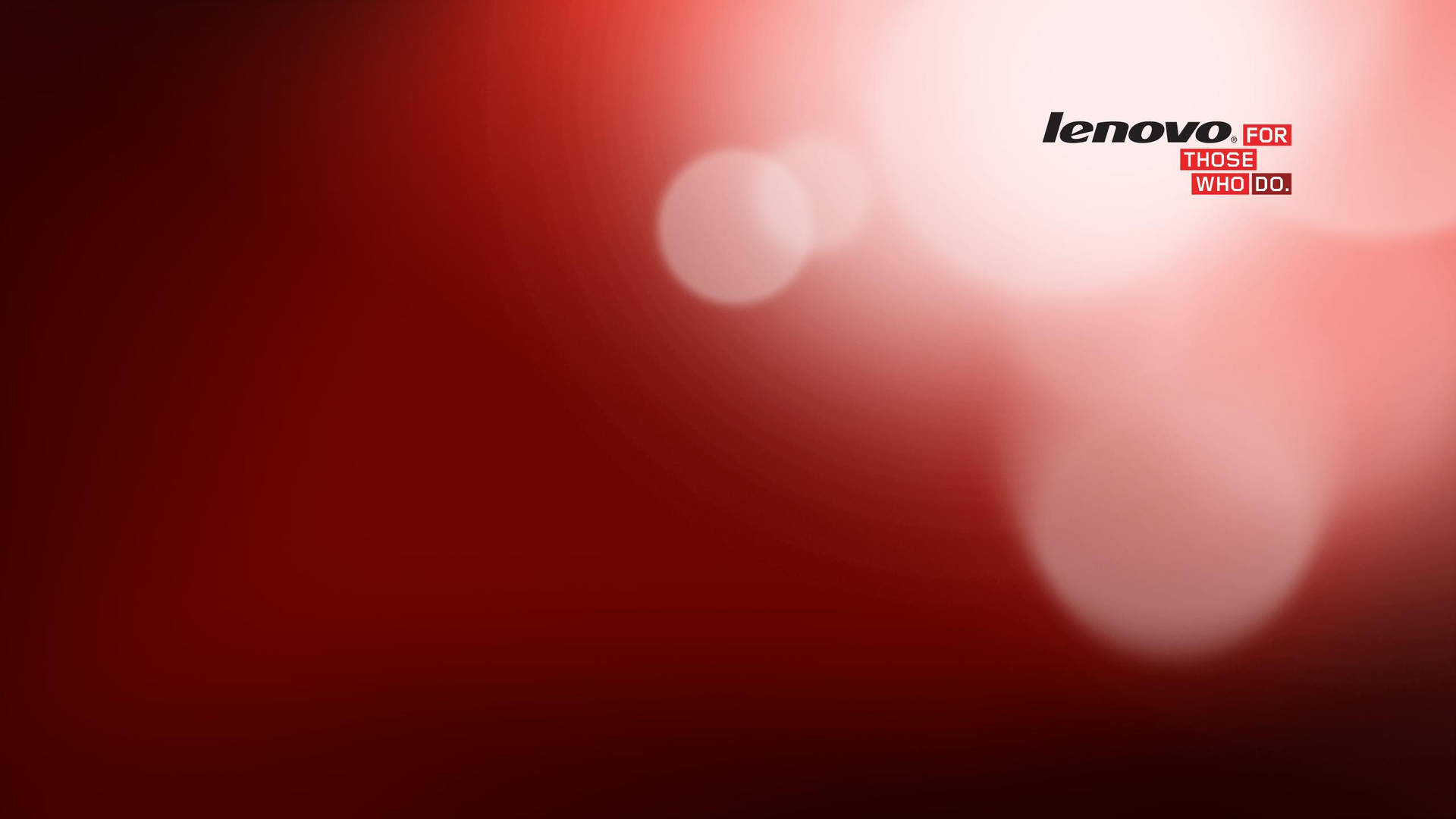 帶有發光圓圈和 Lenovo 標誌的紅色漸變背景