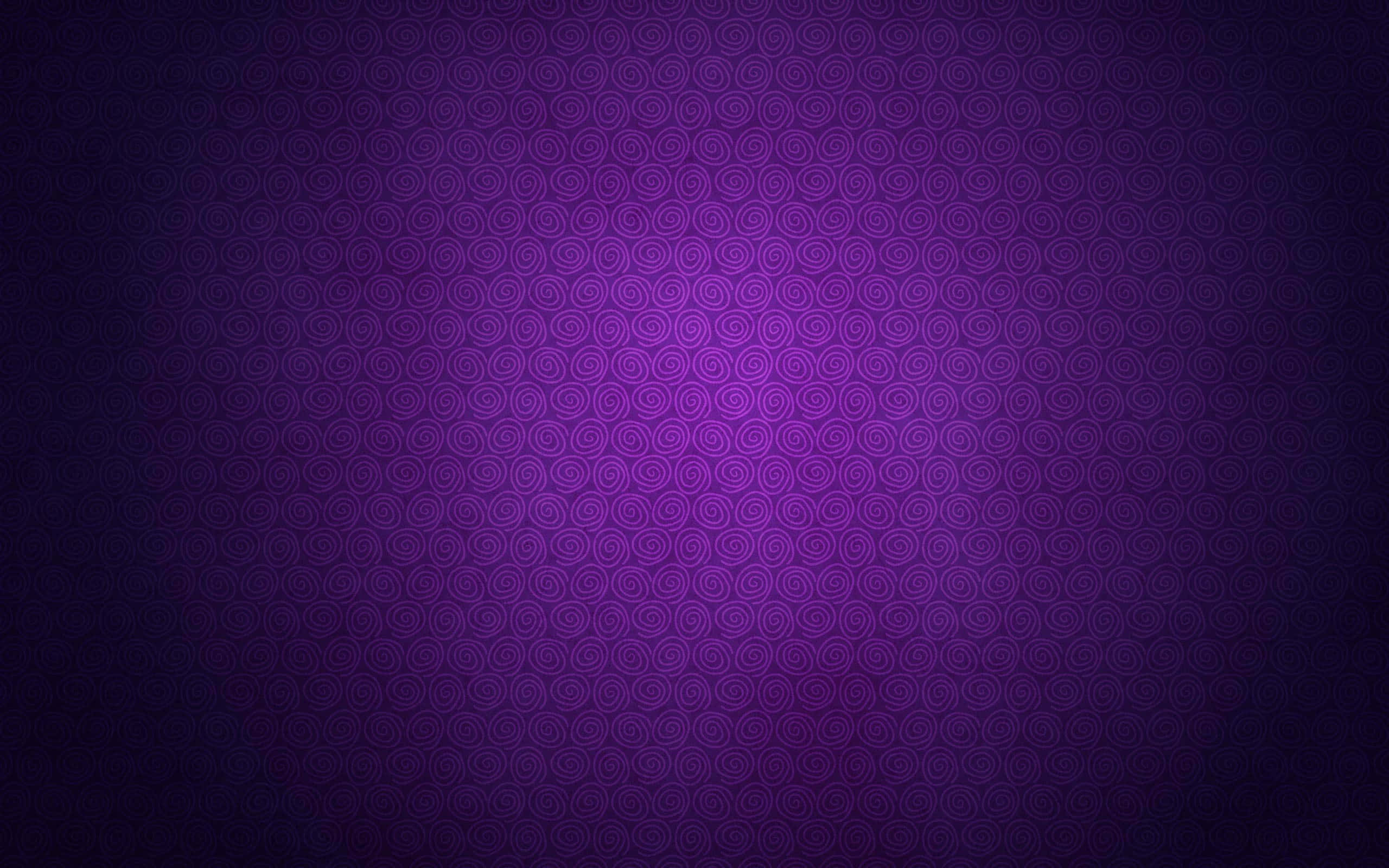 Purple Texture 桌布 壁紙 — 漸變紫色背景，帶有重複螺旋圖案，從暗中心漸變到亮中心。