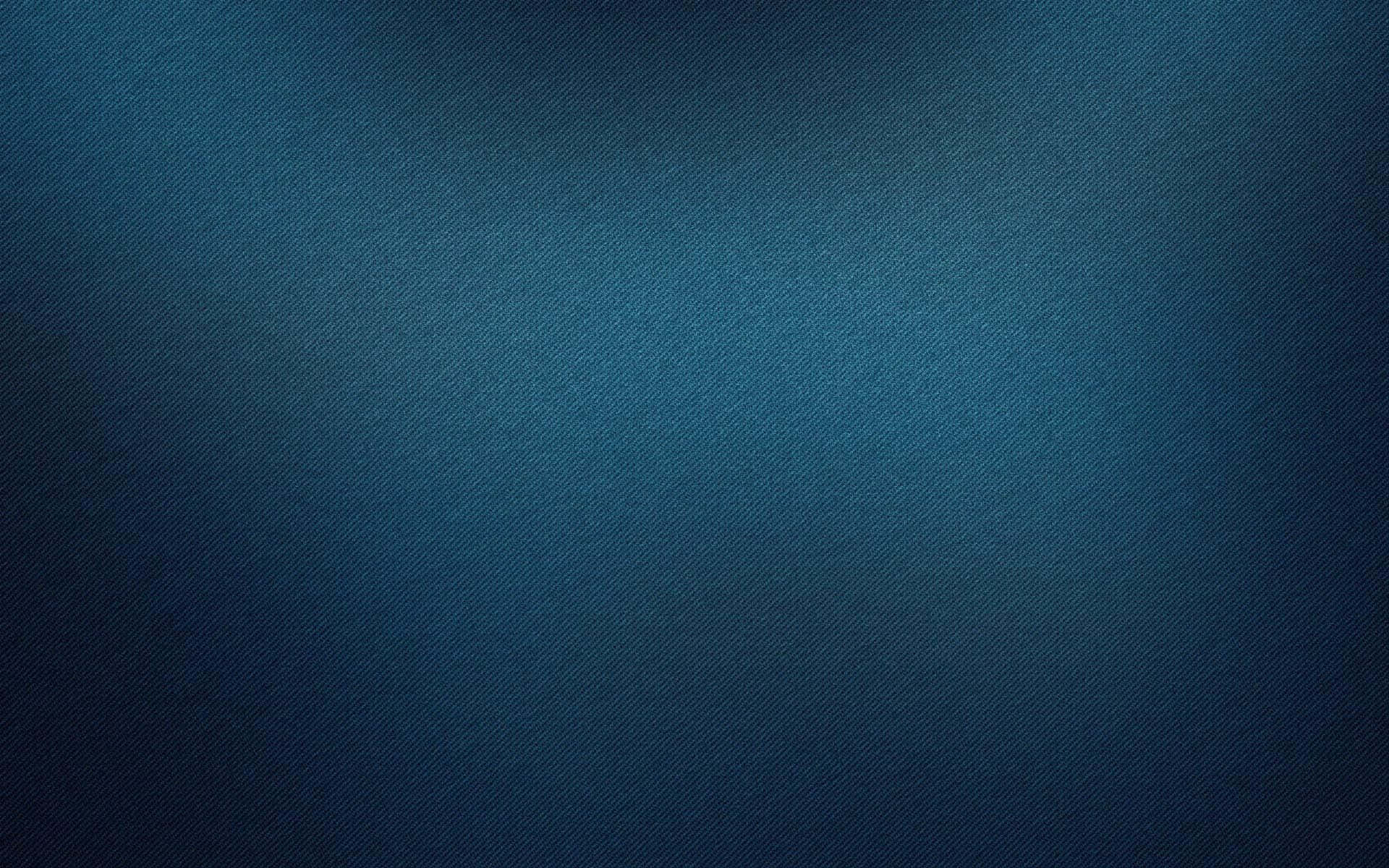 Denim 桌布 壁紙 — 漸變藍色牛仔布紋理從深色調漸變到較淺色調，貫穿整個畫面。