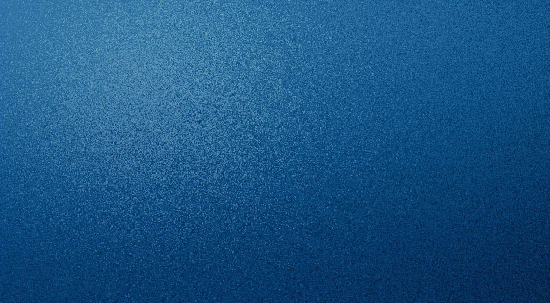 Blue Texture 桌布 壁紙 — 漸變藍色紋理背景，帶有從淺到深褪色的細微斑點。