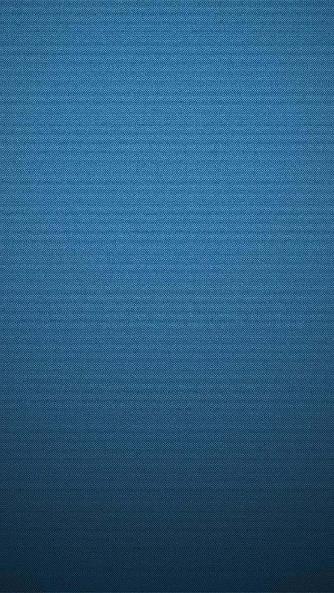 藍色漸變背景，帶有從淺到深漸變的細微圓點紋理。 — iPhone 美學 壁紙