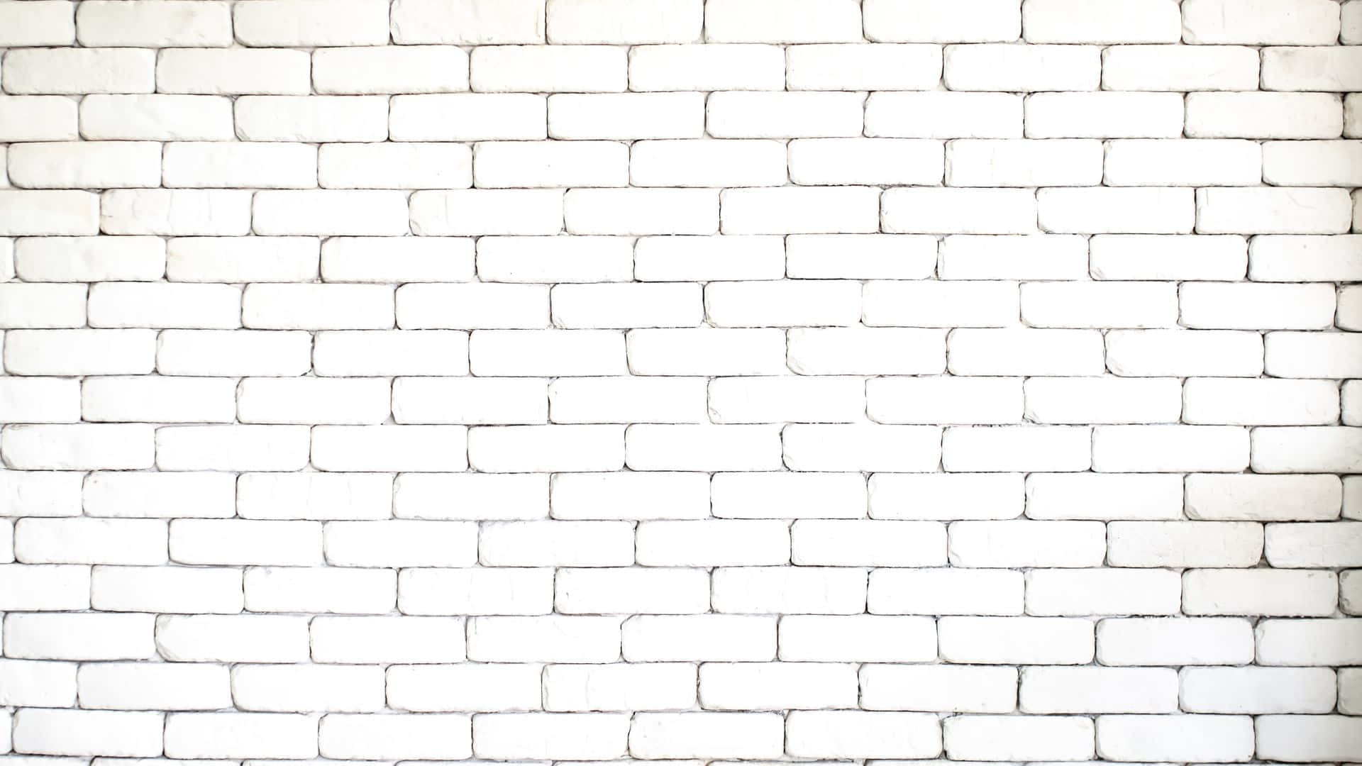 White Brick 桌布 壁紙 — 潔白的磚牆，帶有細微紋理和均勻光線下的柔和陰影。