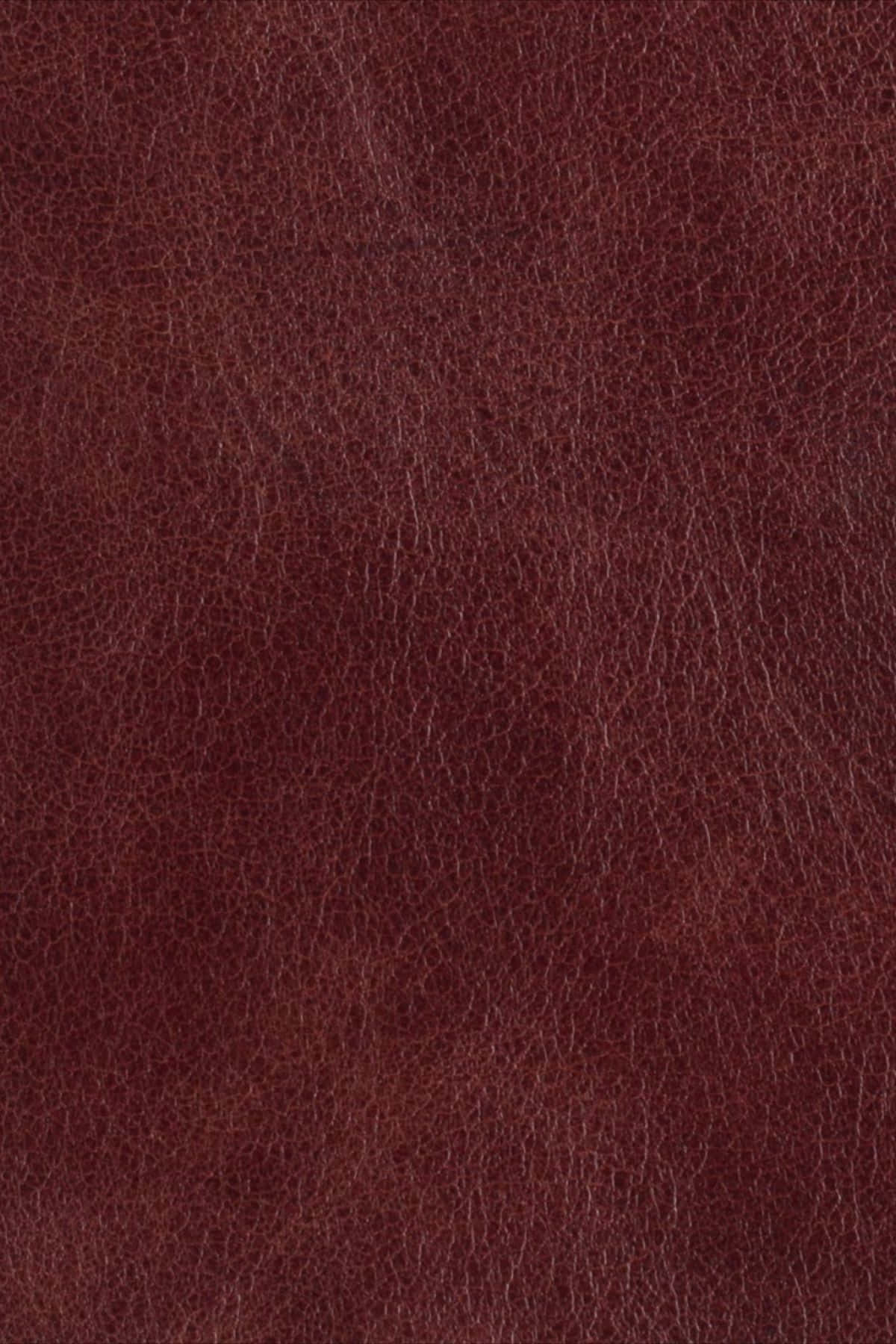texture 桌布 壁紙 — 濃郁勃根地皮革的特寫，帶有天然紋理和細微的質感變化。