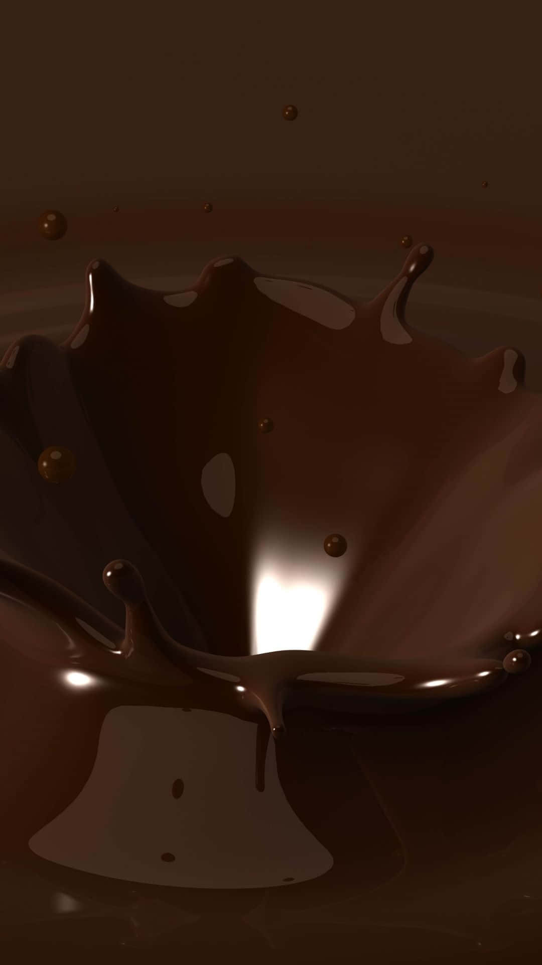 Dark Chocolate 桌布 壁紙 — 濃郁的黑巧克力飛濺在空中，帶有光澤的水滴和明亮的光線反射在其表面。