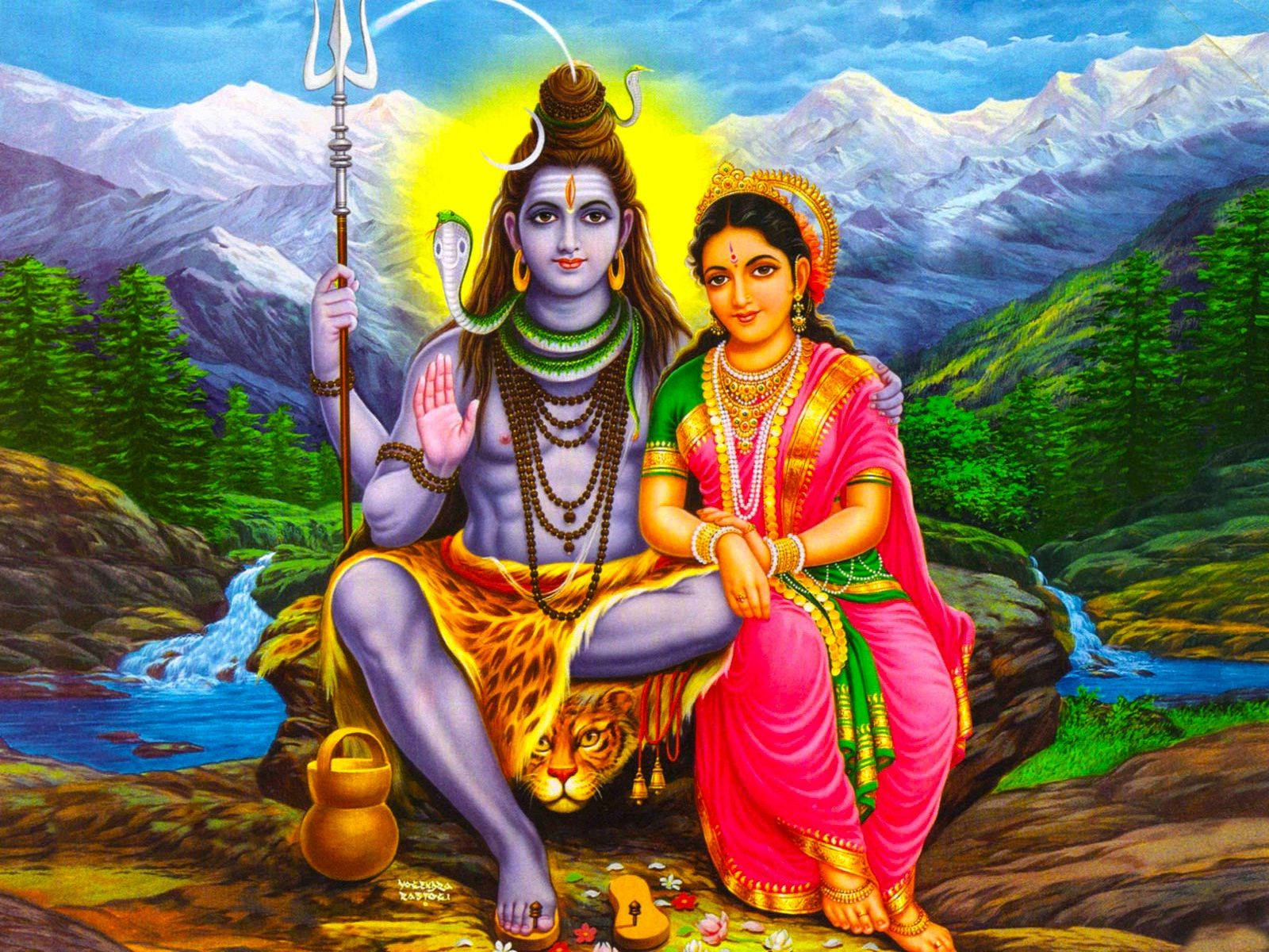 shiva parvathi 桌布 壁紙 — 濕婆與帕爾瓦蒂安詳地坐在岩石山崖上，腳邊有一隻老虎，身後是白雪覆蓋的山峰。