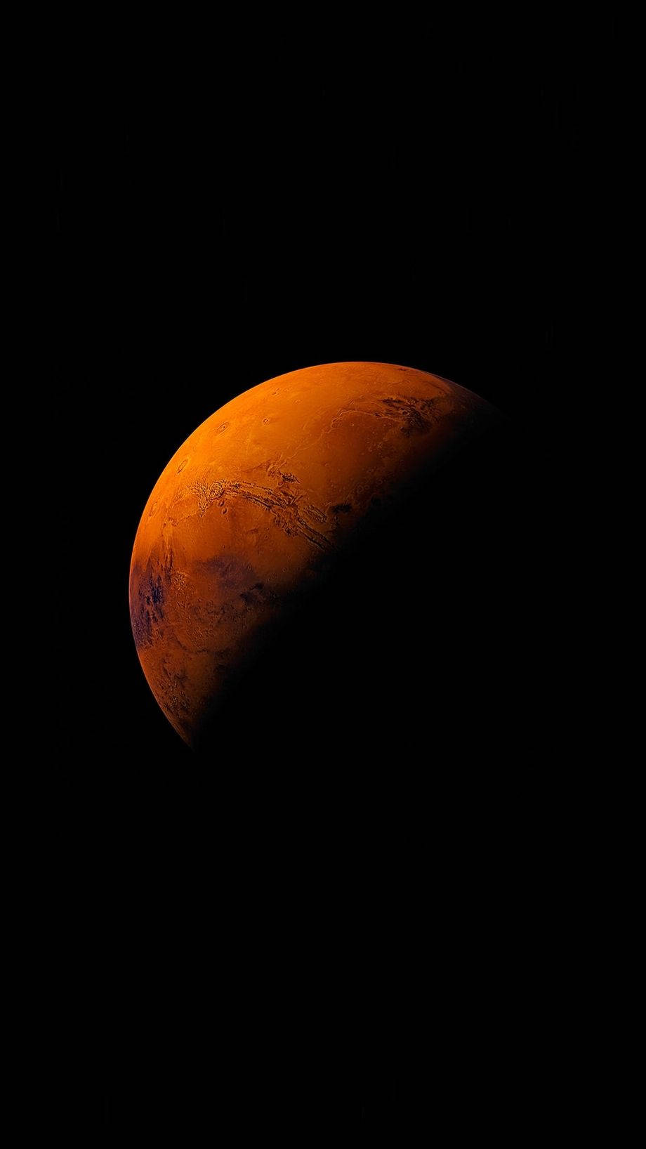 手機 桌布 壁紙 — 火星在太空的黑暗中發出橙色光芒，表面細節清晰可見的壯麗景色。