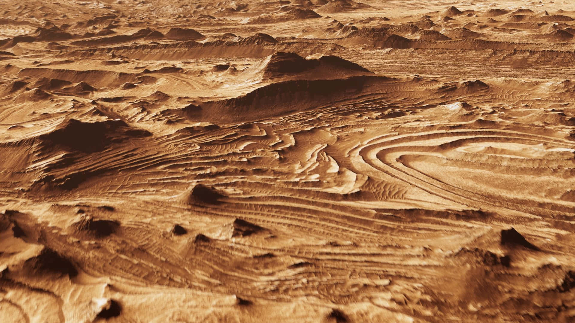 Mars Landscape 桌布 壁紙 — 火星表面的航拍視圖，顯示在明亮日光下溫暖鏽色調的複雜沙丘和山脊。