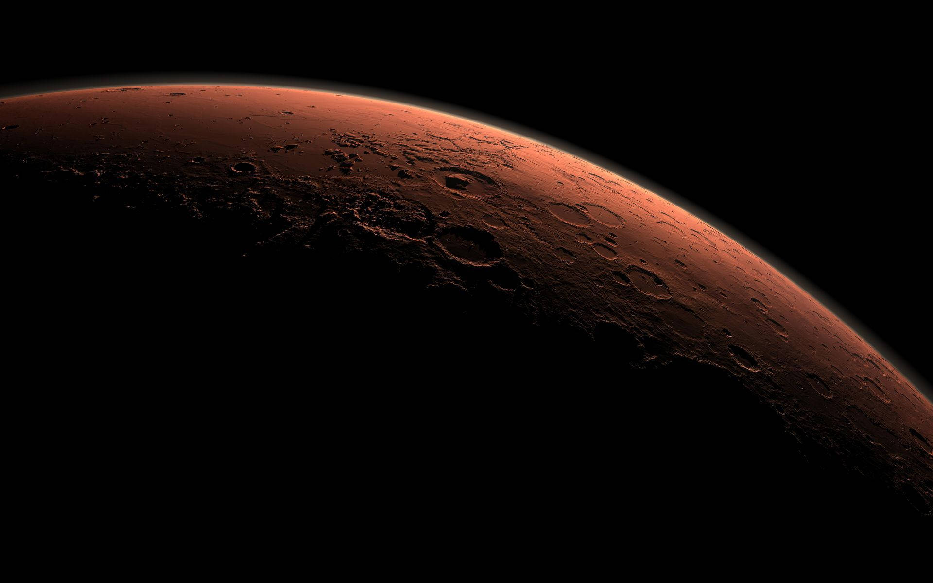 NASA 動態圖片 桌布 壁紙 — 火星鏽色表面在太空黑暗中發光的壯麗景色，可見隕石坑和地形細節。