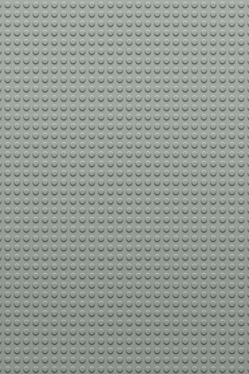 Light Gray iPhone 桌布 壁紙 — 灰色LEGO底板的特寫，帶有均勻的圓形凸點網格。