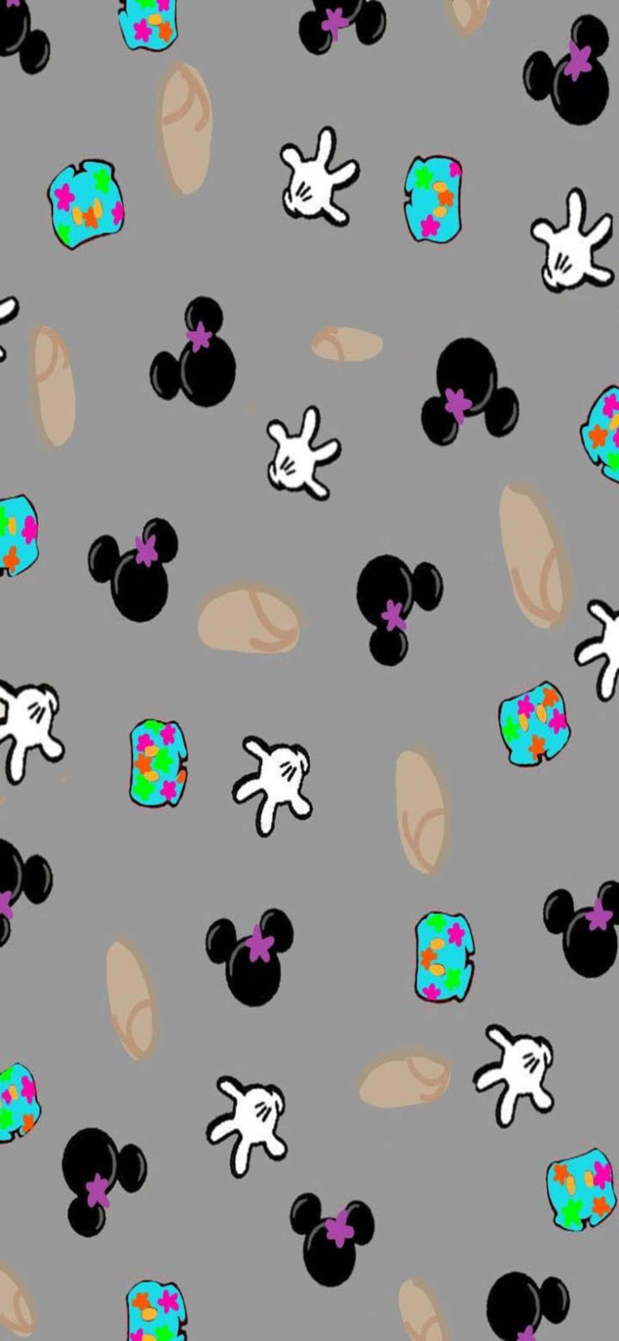 iPhone Xs Max Disney 桌布 壁紙 — 灰色壁紙圖案，上面散落著黑色米妮老鼠頭、白色手套和色彩繽紛的星形禮物盒。
