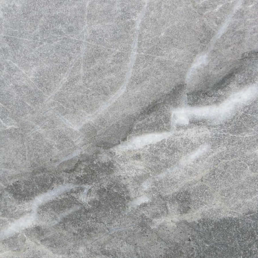 Aesthetic Gray Marble 桌布 壁紙 — 灰色大理石特寫，帶有漩渦狀白色紋理和細微斑點，營造出奢華天然石材質感。
