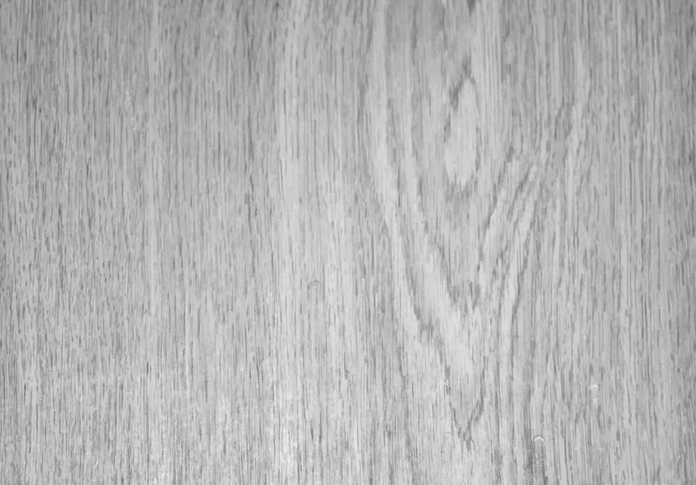 Gray Wood 桌布 壁紙 — 灰色木紋紋理特寫，帶有微妙的自然圖案和柔和光線。
