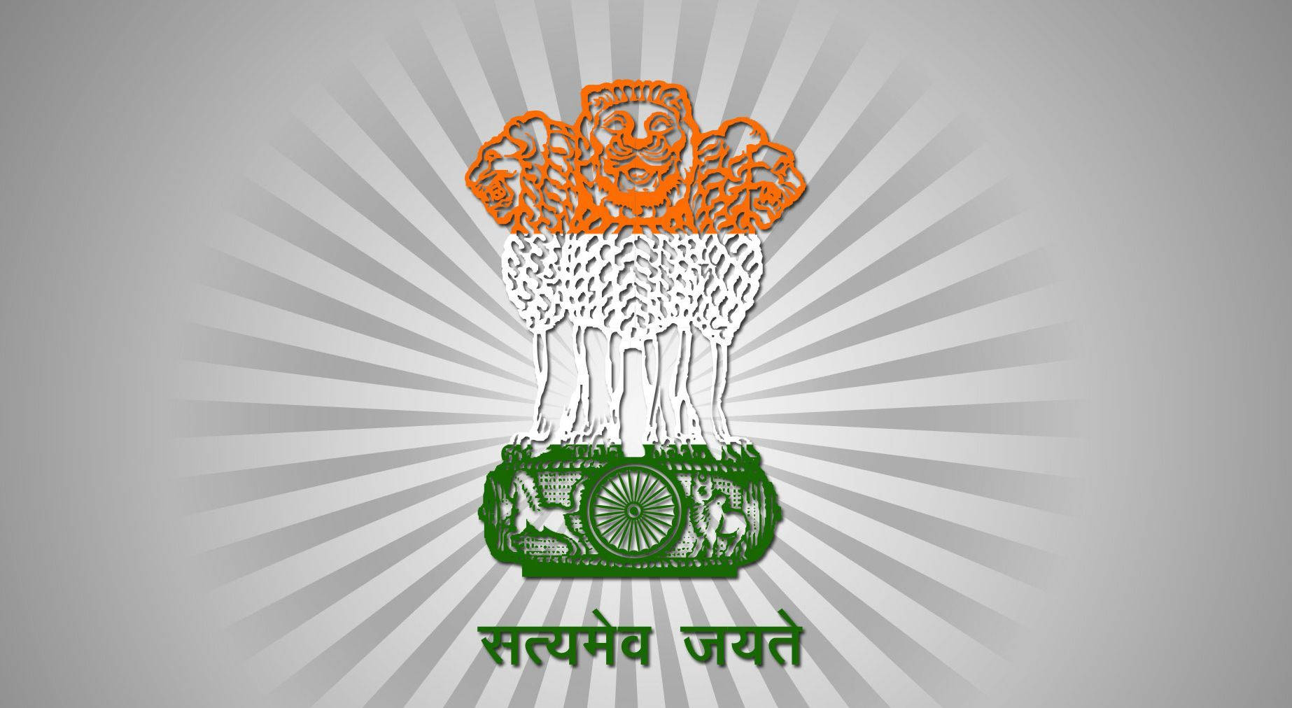 Indian 桌布 壁紙 — 灰色背景上帶有放射狀灰色線條的三色阿育王法輪標誌。