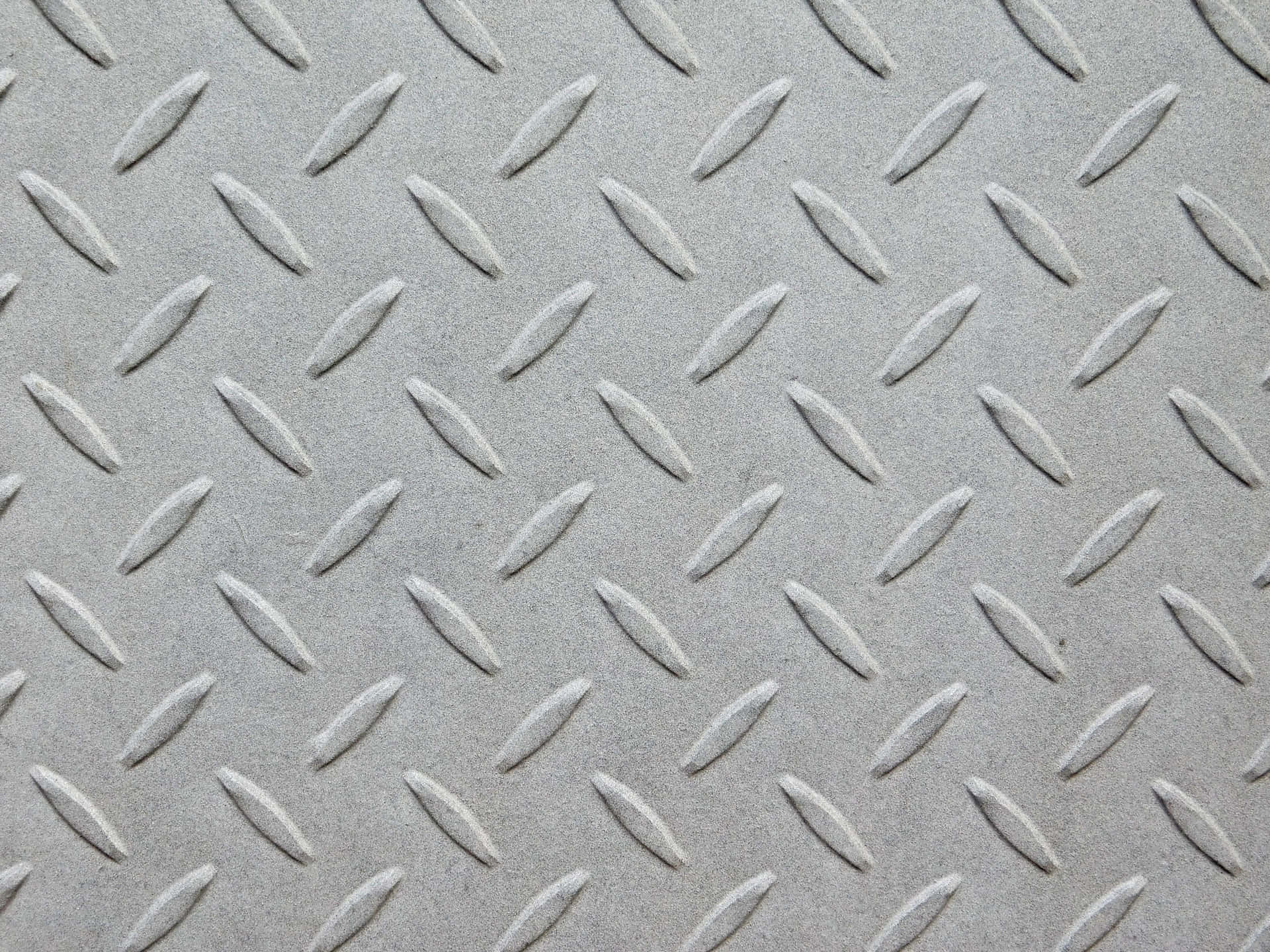 Metal texture 壁紙 — 灰色菱形金屬板表面的特寫，帶有凸起的紋理圖案。