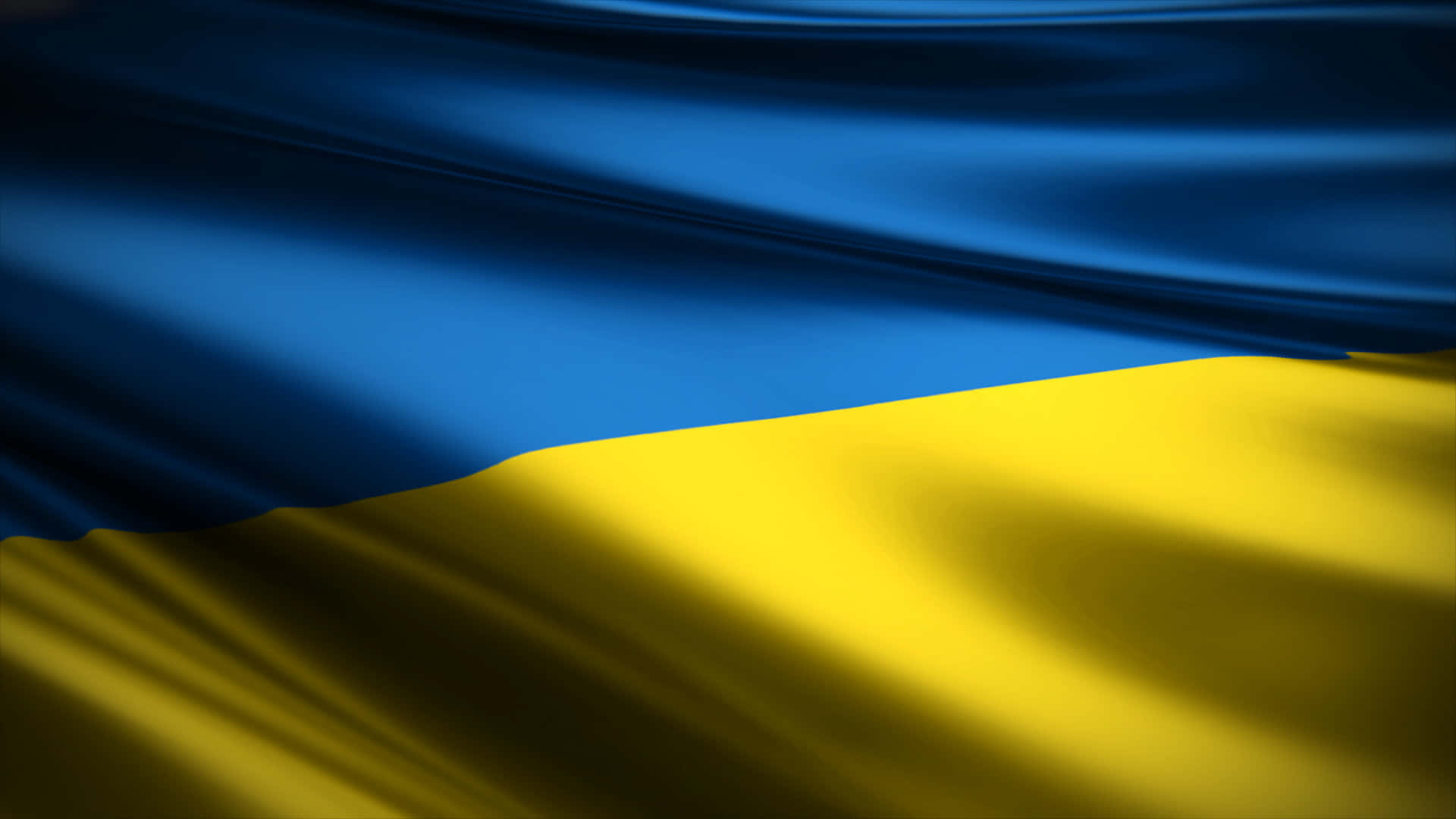 Ukraine 桌布 壁紙 — 烏克蘭國旗的特寫，深藍色和金色橫條在風中飄揚。