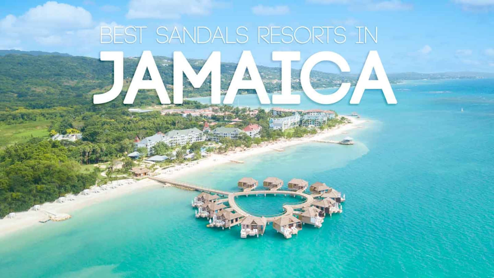 Jamaica 桌布 壁紙 — 牙買加 Sandals Resorts 的鳥瞰圖，展現碧綠海水、水上平房和鬱鬱蔥蔥的綠色山丘。