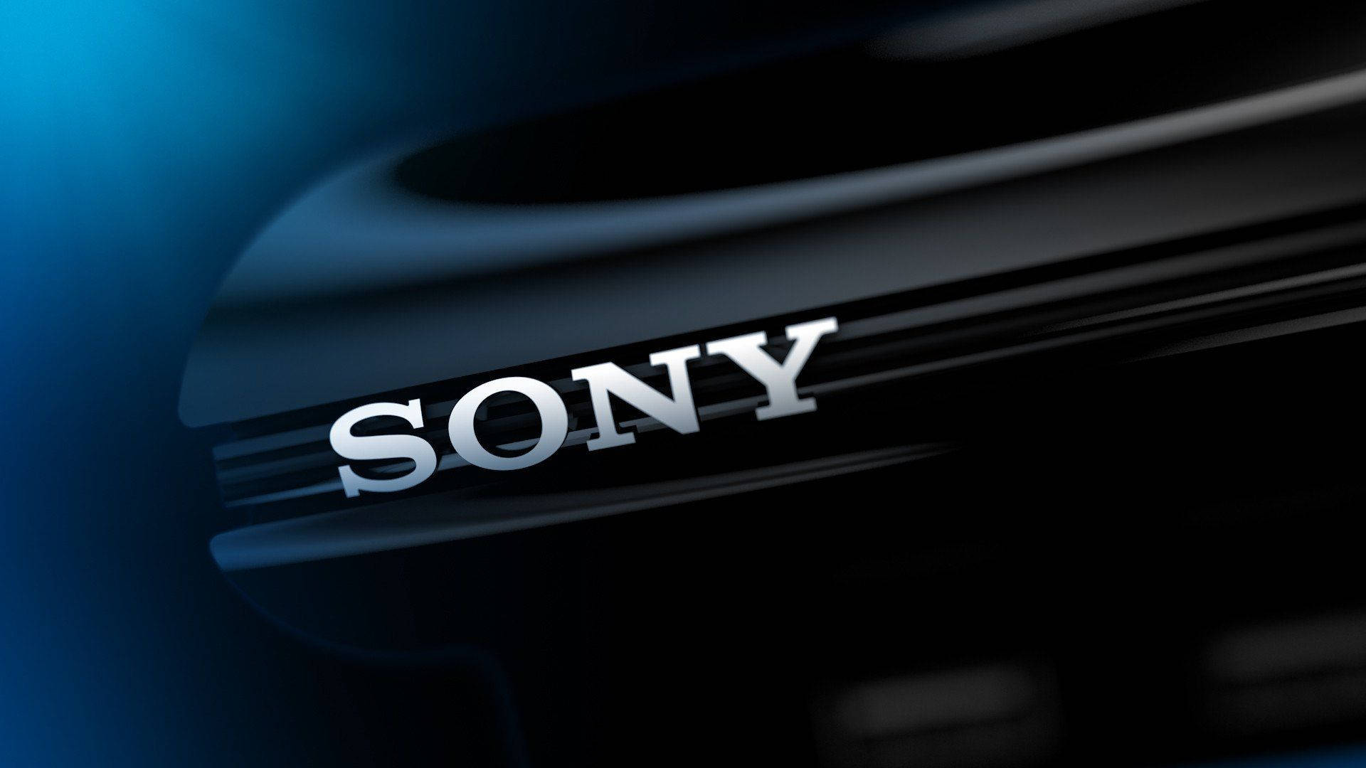 Sony 桌布 壁紙 — 特寫一個時尚的銀色Sony標誌，在深藍色漸變背景上發出柔和光芒。