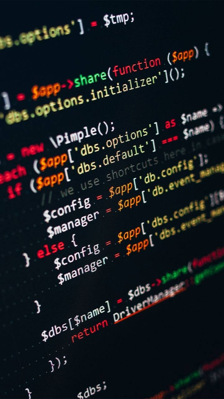 programming iPhone 桌布 壁紙 — 特寫發光多彩程式碼行在深色螢幕上，顯示程式設計語法和變數。