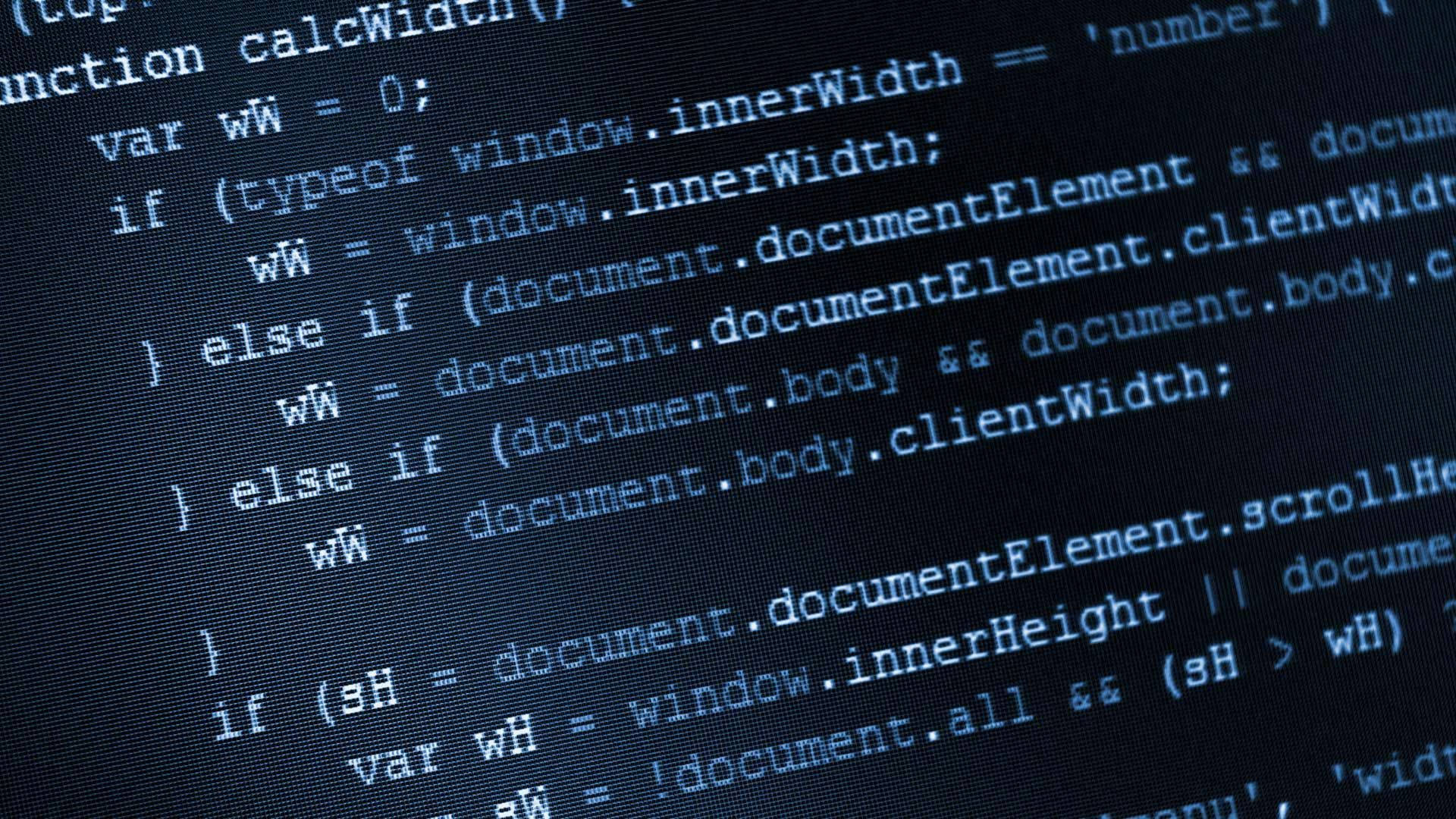 Information 桌布 壁紙 — 特寫發光藍色JavaScript代碼在暗色電腦顯示器螢幕上滾動。