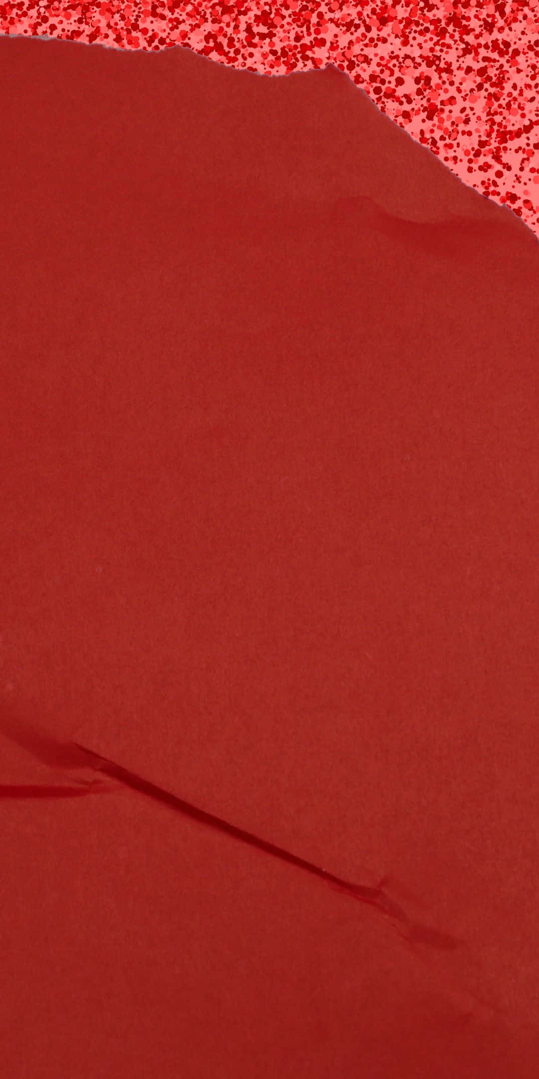 Red Texture 桌布 壁紙 — 特寫紋理深紅色紙張，撕裂邊緣露出上方斑點紅色圖案。