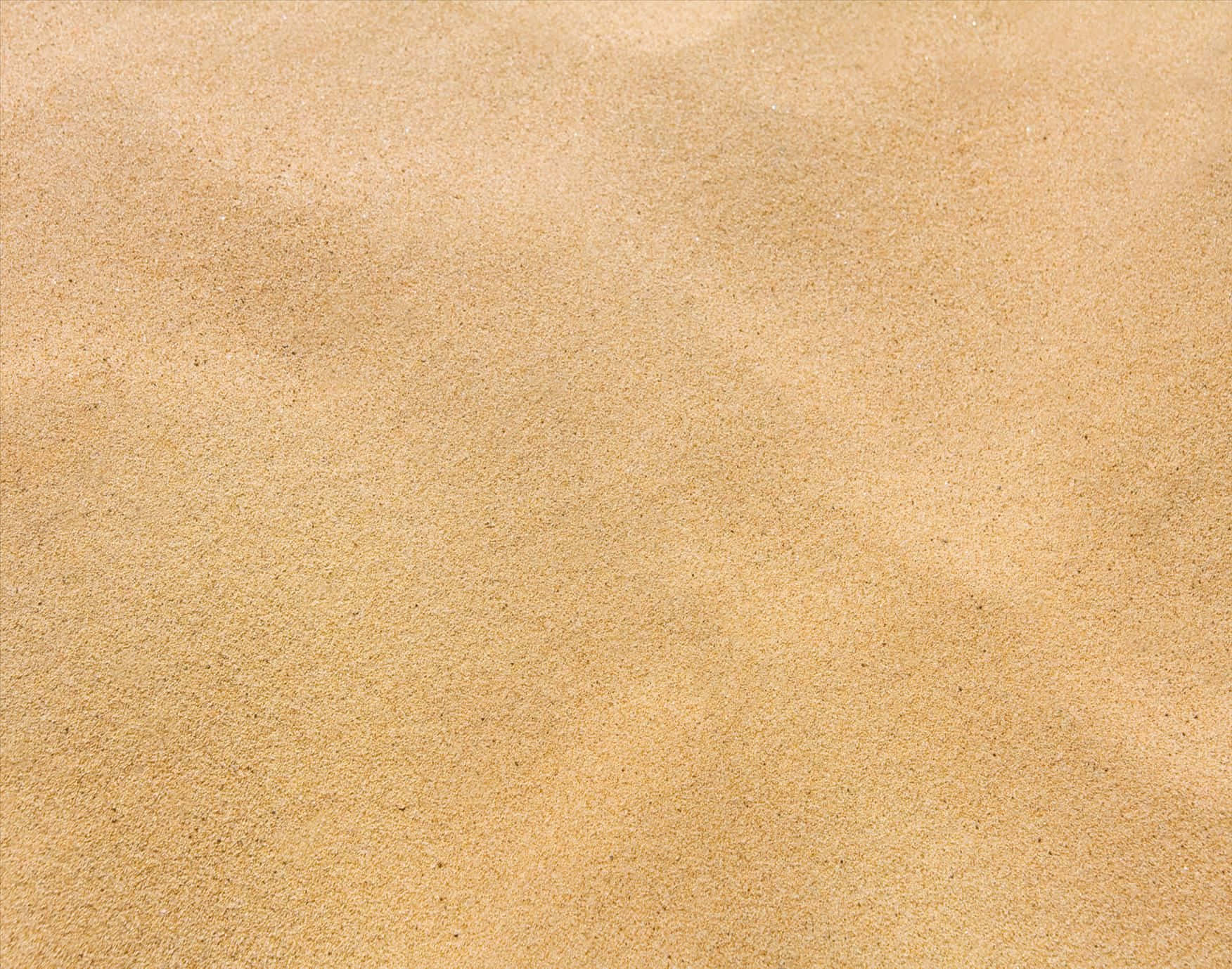 sand 桌布 壁紙 — 特寫細緻金色沙粒，柔和波紋與自然質感，在明亮陽光下。