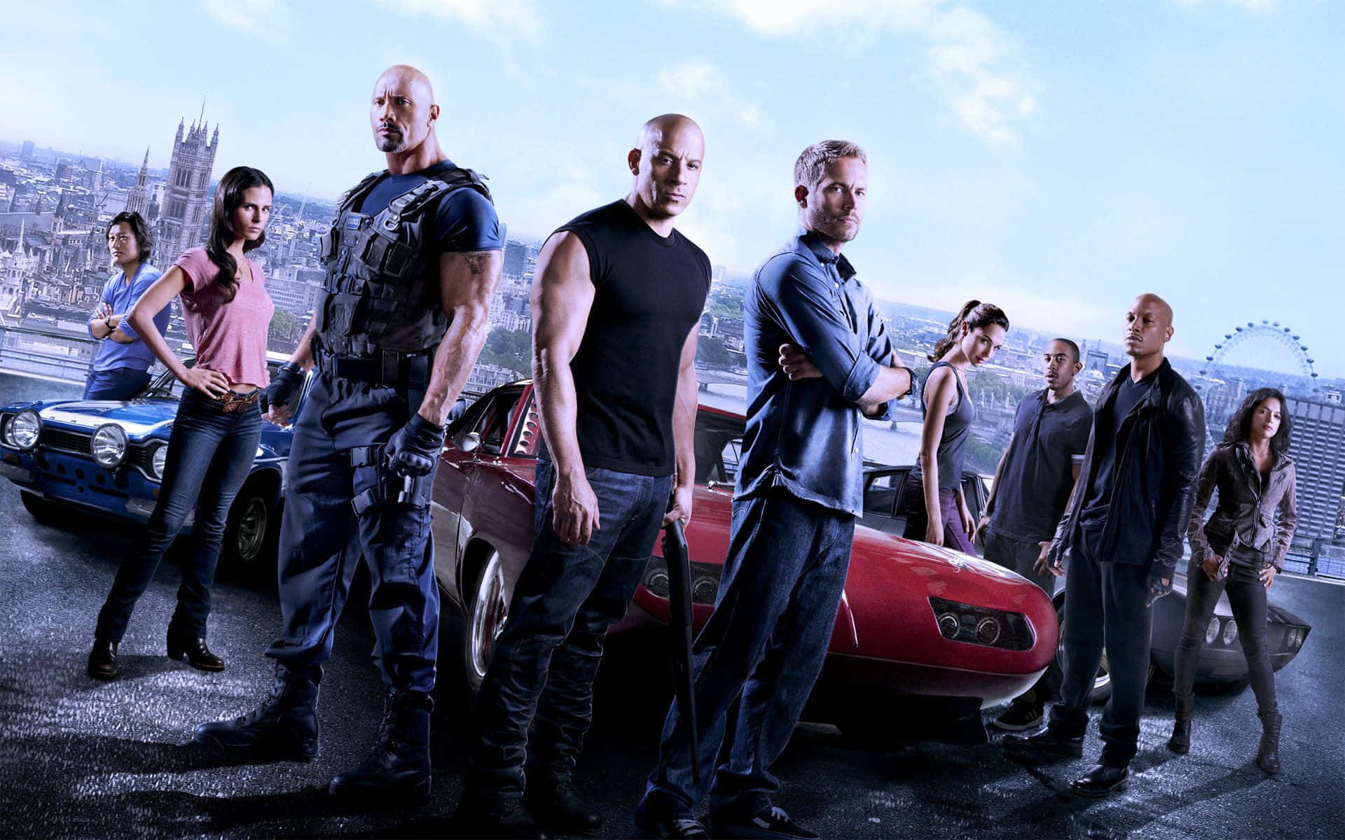 Fast And Furious 桌布 壁紙 — 《玩命關頭》團隊自信地站在倫敦天際線背景下，與肌肉車一同展現風采。