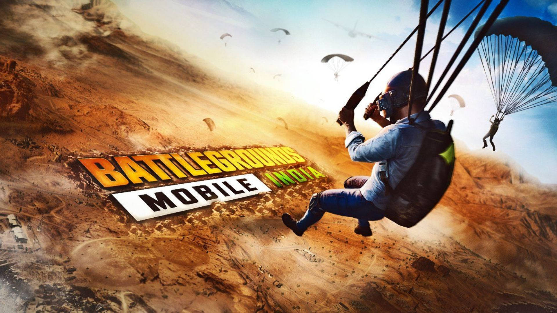 Bgmi 桌布 壁紙 — 玩家在廣闊的沙漠景觀上空跳傘，這是Battlegrounds Mobile India的充滿活力的遊戲廣告。