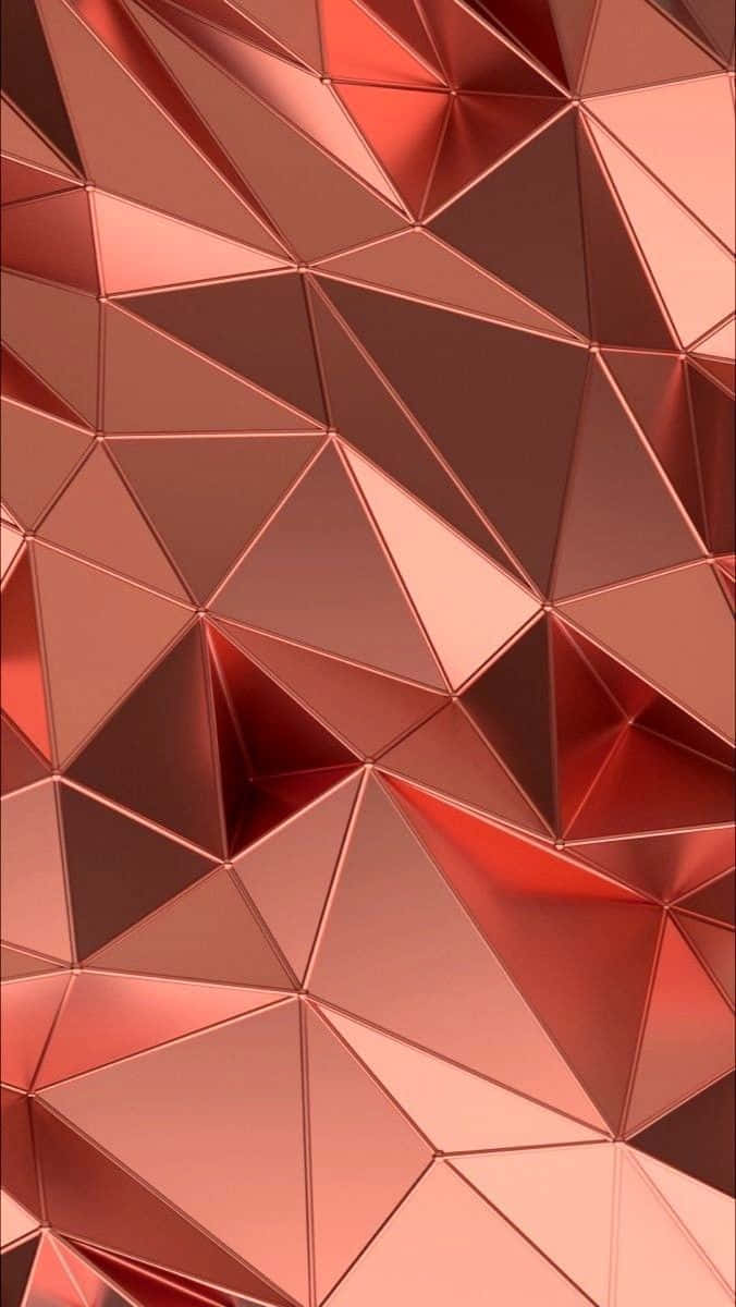 Rose Gold Color 桌布 壁紙 — 玫瑰金幾何圖案的近距離特寫，三角形切面在現代抽象設計中反射光線。