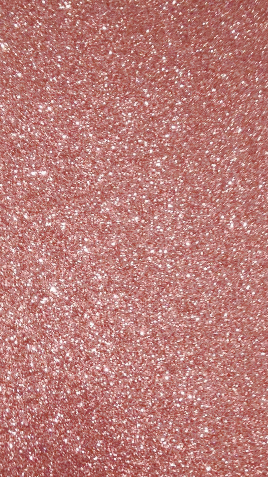 Rose Gold Ombre 桌布 壁紙 — 玫瑰金色閃粉質感的特寫，表面散佈著閃爍的白色顆粒。