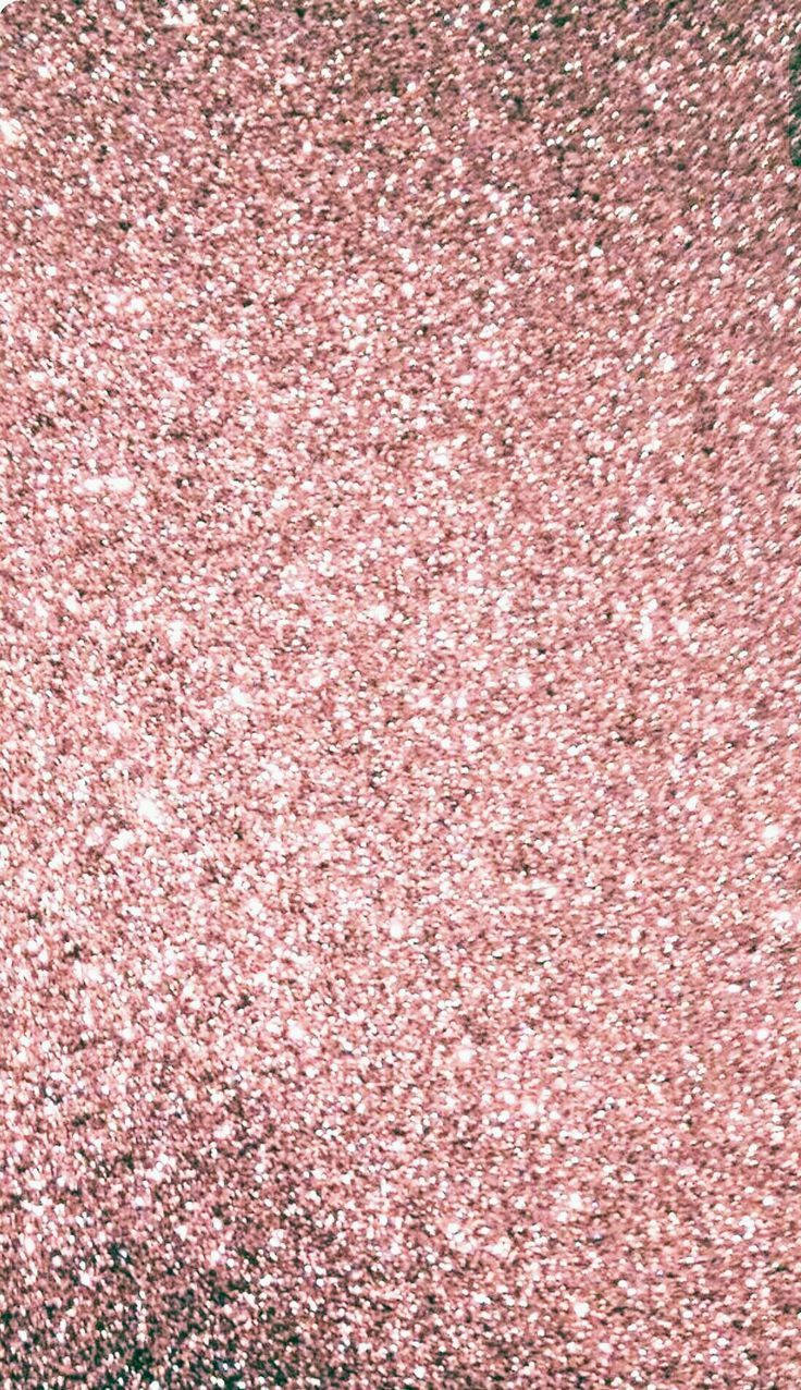 Rose Gold Ombre 桌布 壁紙 — 玫瑰金閃粉的近距離特寫，散落白色斑點，營造出閃爍的紋理表面。