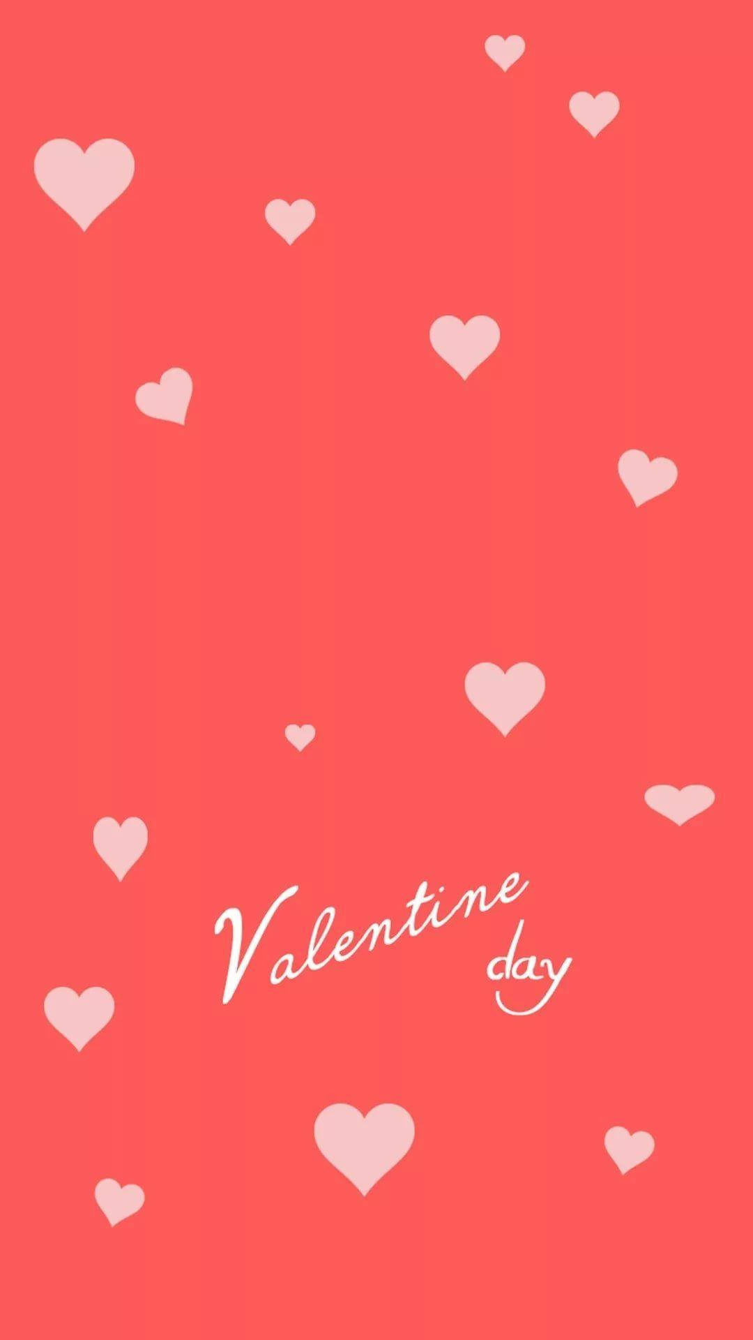 Tumblr Valentines Day 桌布 壁紙 — 珊瑚粉紅色背景，點綴著散落的淺粉紅色愛心和草書文字情人節。
