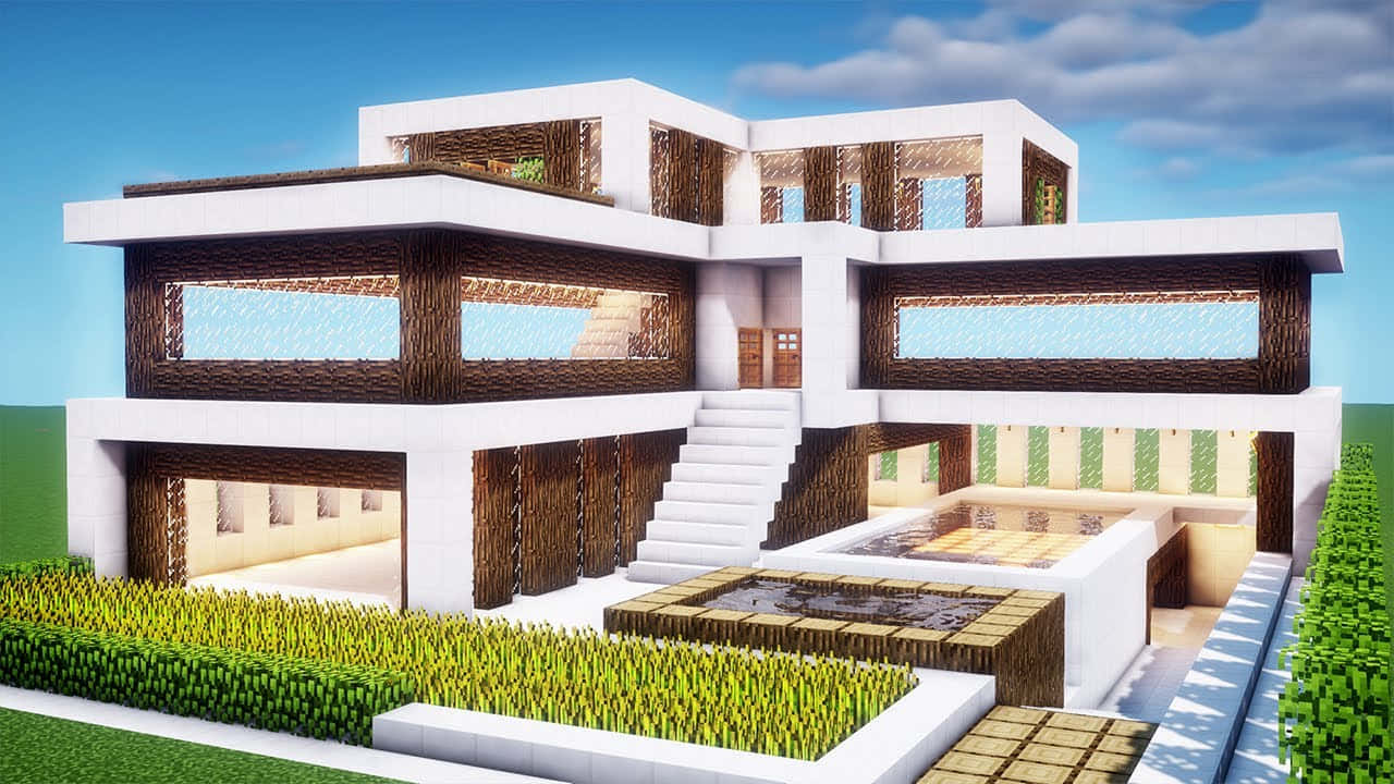 Minecraft Houses 桌布 壁紙 — 現代Minecraft豪宅，白色方塊搭配木質點綴，設有分層陽台、樓梯，在明亮藍天下擁有鬱鬱蔥蔥的綠色景觀。