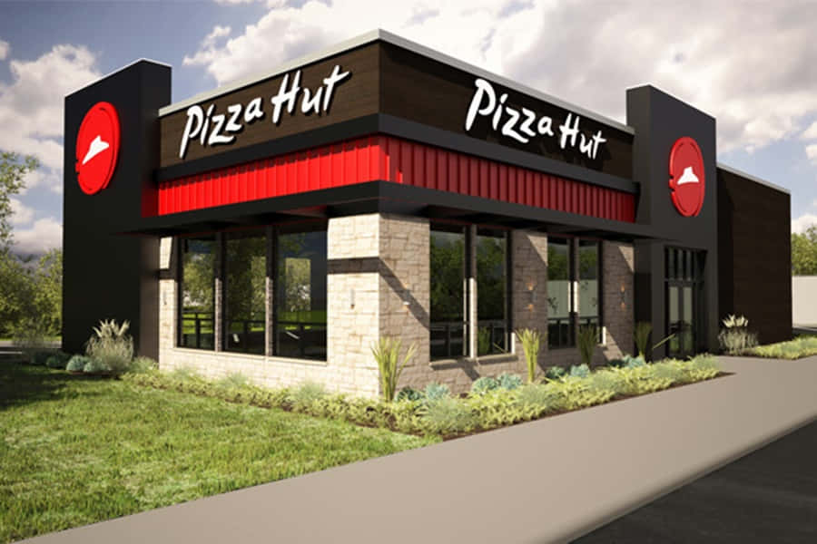 Pizza Hut餐廳，紅黑外觀和石牆。 — 必勝客 壁紙