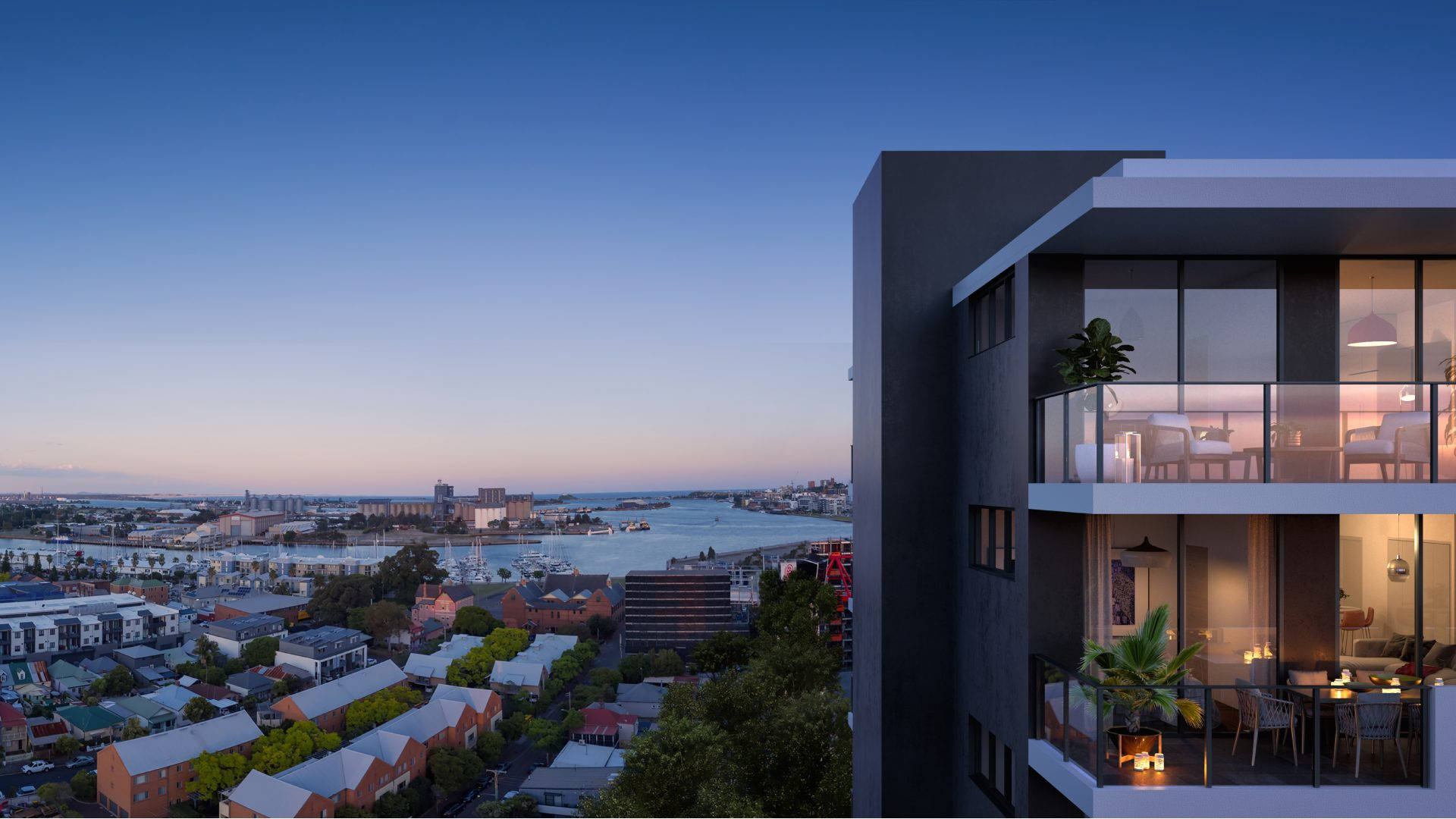 Estate 桌布 壁紙 — 現代公寓大樓在暮色中俯瞰港口，溫暖的室內燈光在清涼的藍天下閃爍。