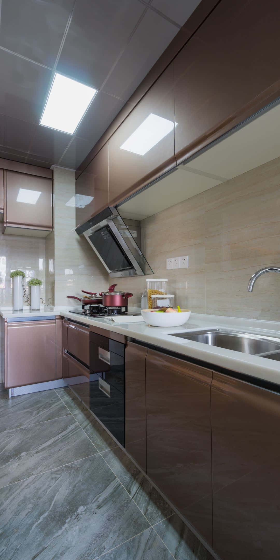 Pixel 3 Kitchen 桌布 壁紙 — 現代廚房，配有時尚玫瑰金櫥櫃、大理石地板和明亮的LED天花燈。